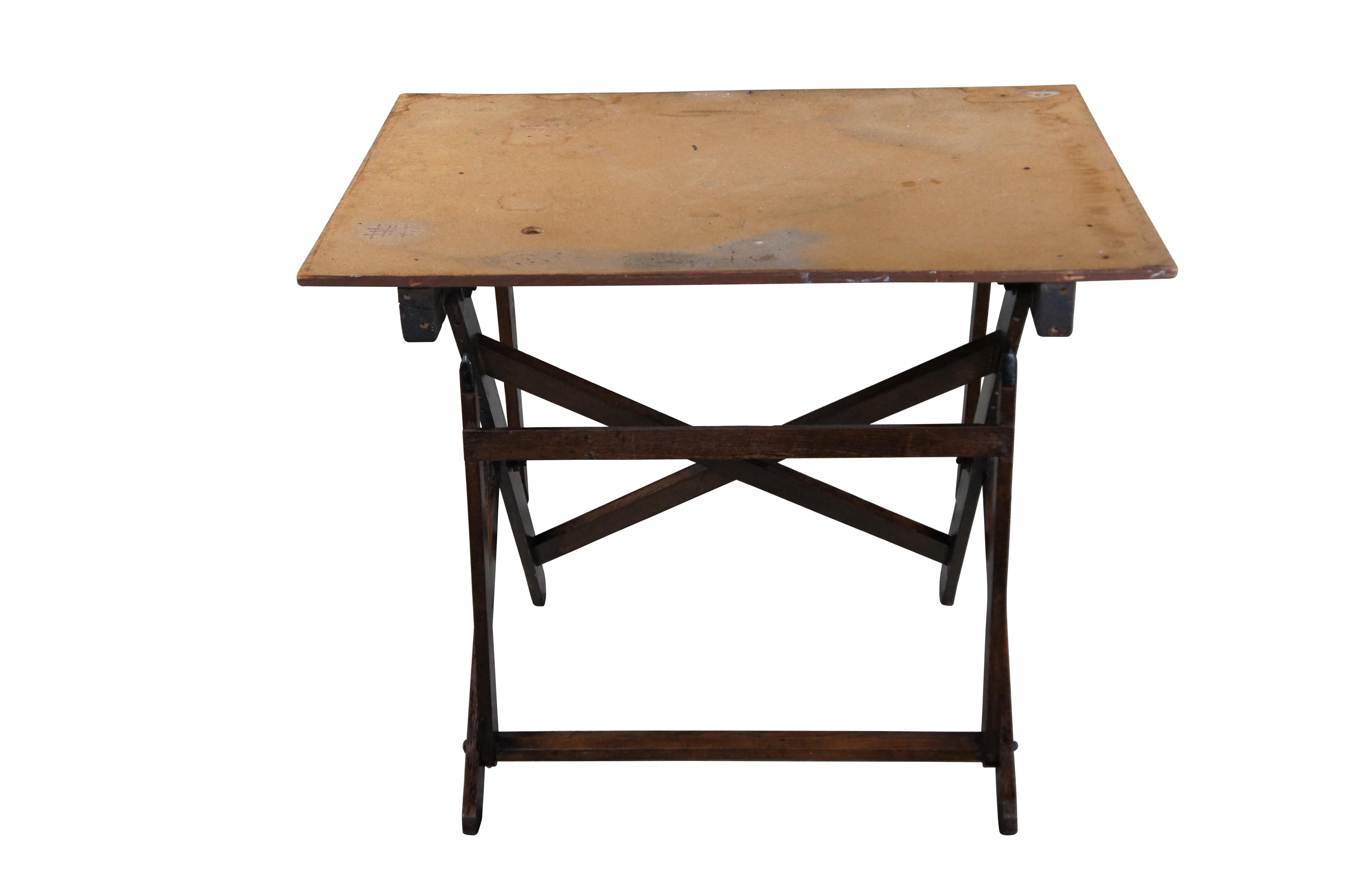 Antique early 20th century Cole industrial architects drafting table / drawing table / artist easel.  Made of  oak featuring a folding base and large rectangular surface.

Dimensions:
32