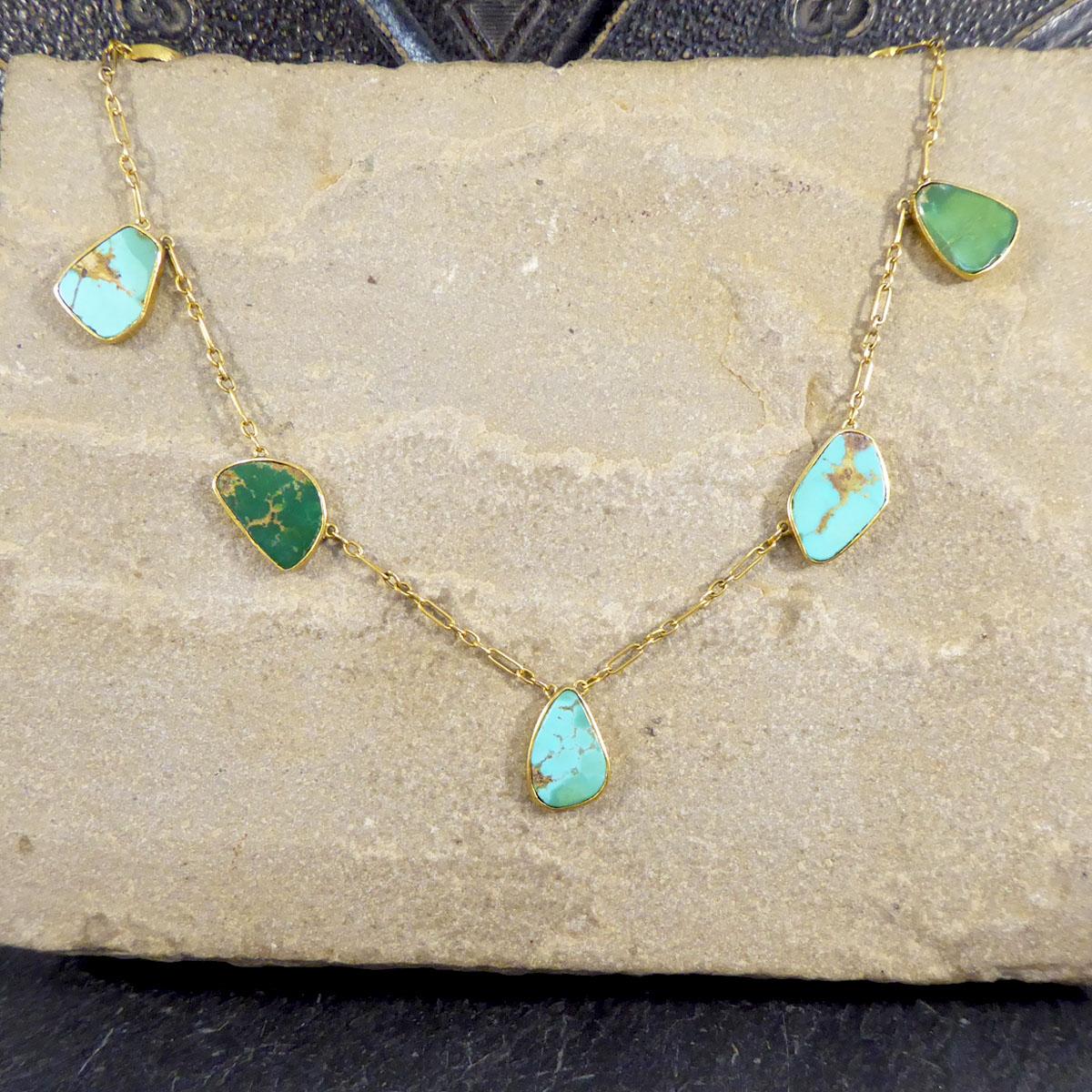 A lovely antique necklace that has been crafted in the Edwardian era with individual Turquoise stones in a rub over collar setting. The setting and chain itself is made form 15ct Yellow Gold and has a delicate and elegant feel to it.

Condition: