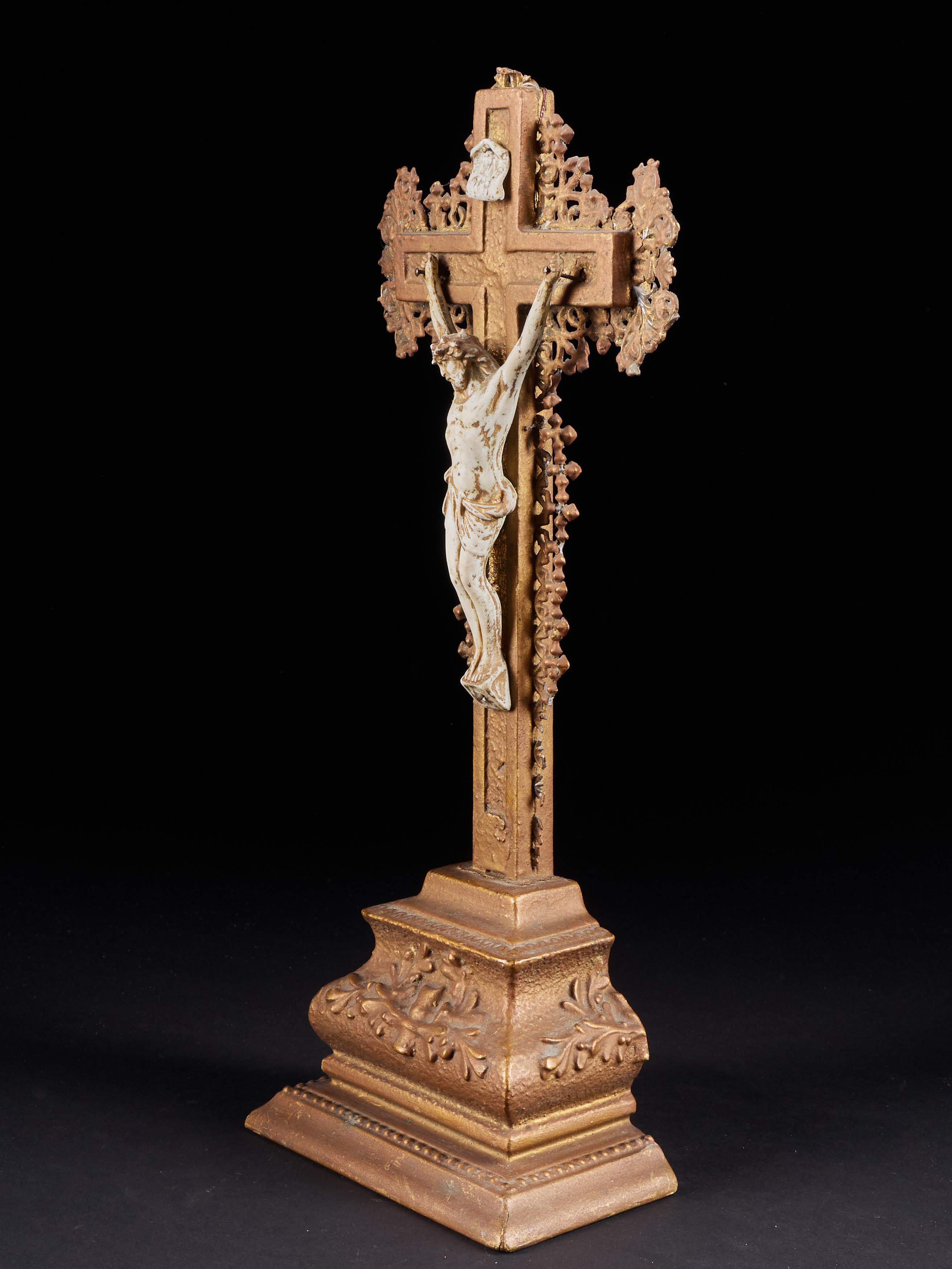 Elegant standing crucifix and Jesus made of resin with gold finish. A genuine antique with metal ornaments and a cross made of plaster which should fill interiors with character.