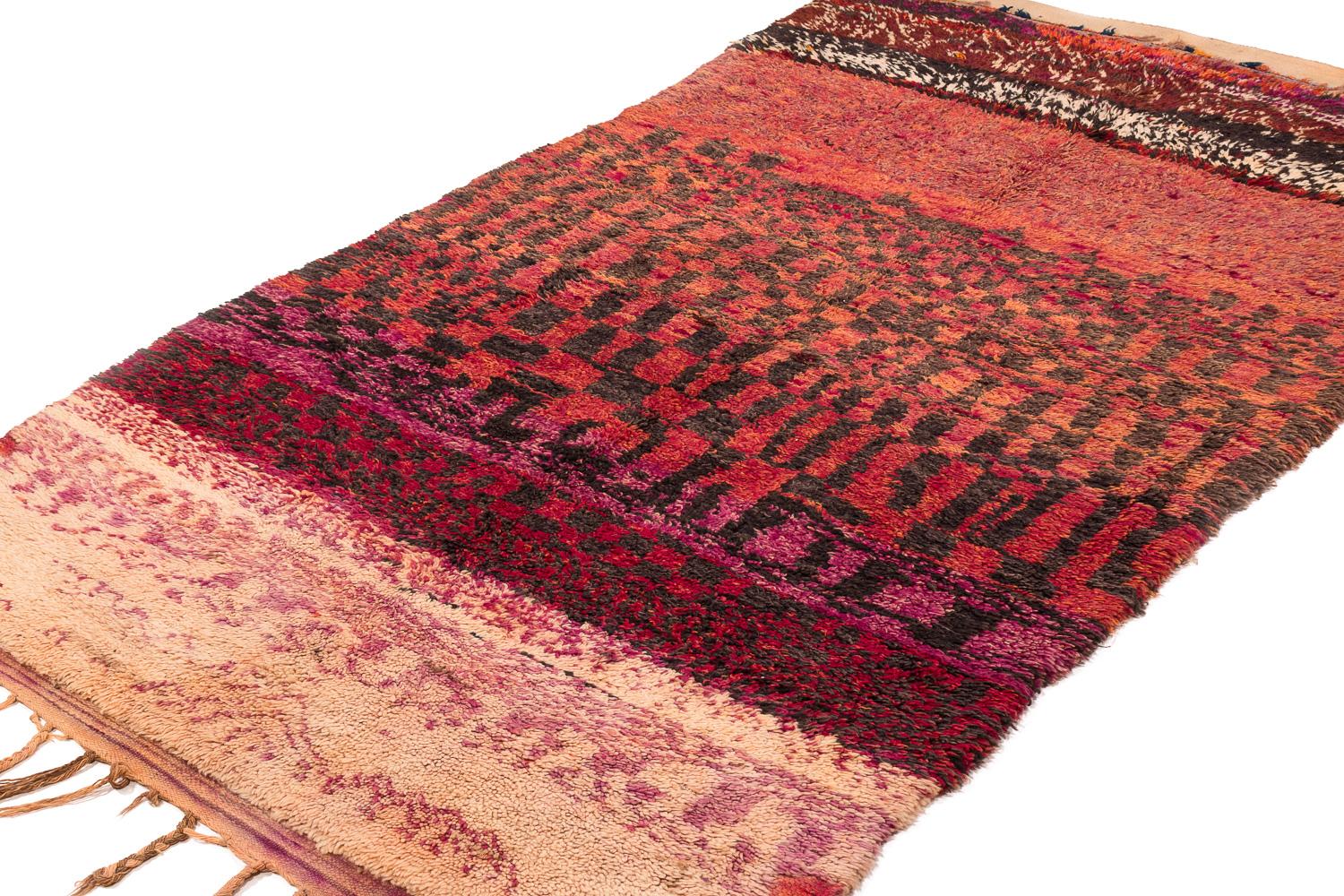 A rare collectible Moroccan vintage shag rug. This antique handwoven rug came from the Beni Mguild tribe from the central middle Atlas mountains. This piece came out of an important collection of Moroccan rugs that was collected early on. It was an