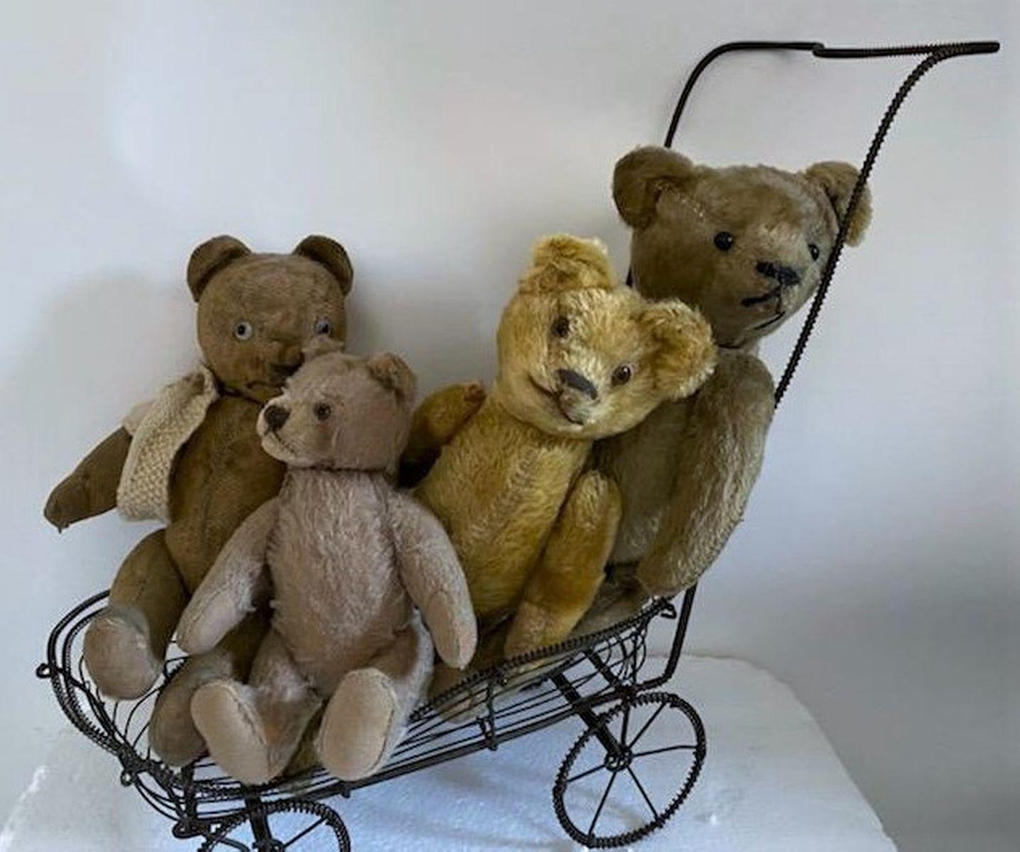 Group of four vintage jointed bears with glass eyes. Great collection of bears in good condition.

Largest bear measures 14 high x 5 wide
Smallest bear measures 9 high x 4 wide.