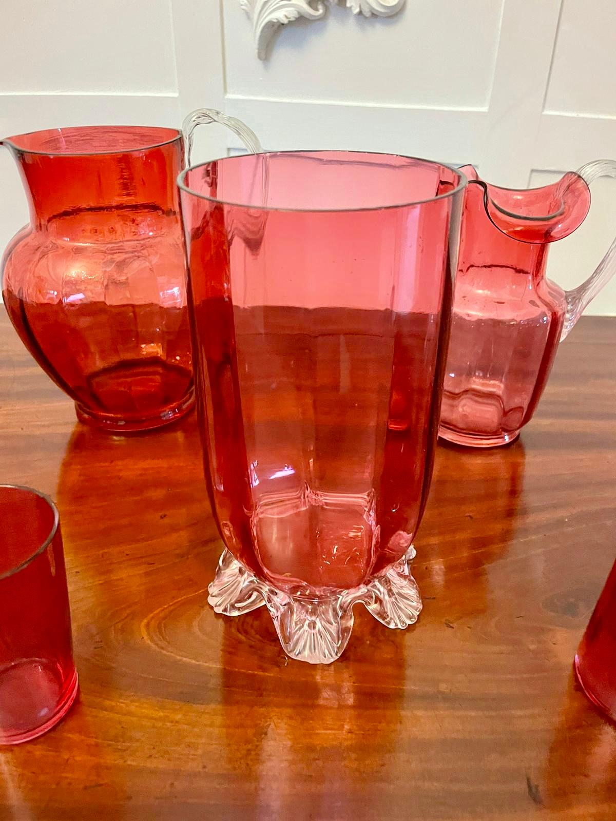Antique collection of Victorian quality cranberry glass items consisting of seven antique Victorian quality cranberry glass jugs, wine glass and vases


All in perfect original condition


Dimensions:
Height 20 cm
Width 10 cm
Depth 10 cm


Dated