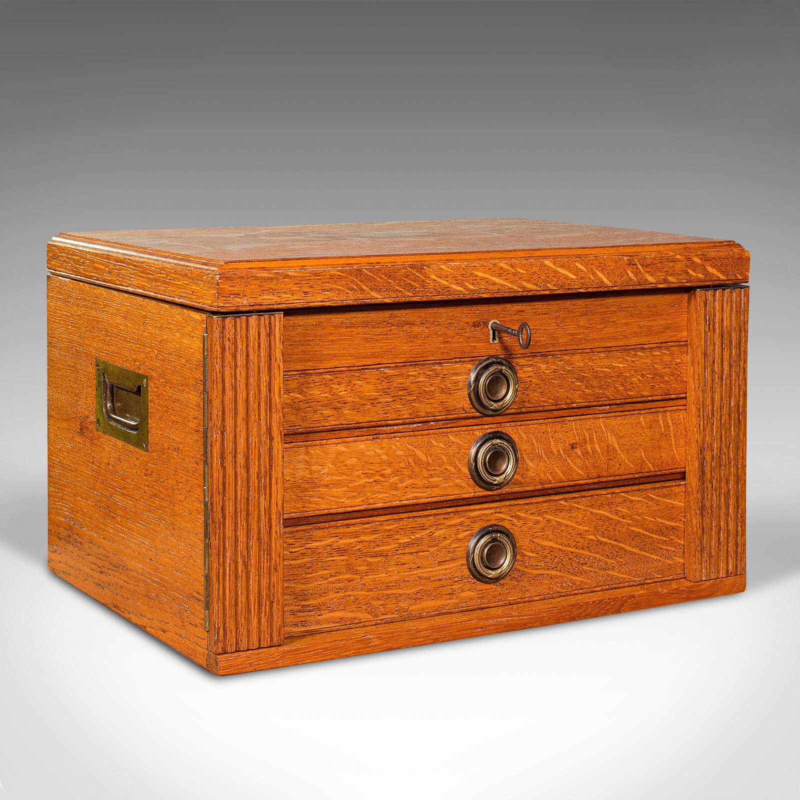 This is an antique collector's specimen case. An English, oak chest or jewellery box with Wellington style locking arms, dating to the Edwardian period, circa 1910.

Fascinating specimen case with attractive finish
Displays a desirable aged