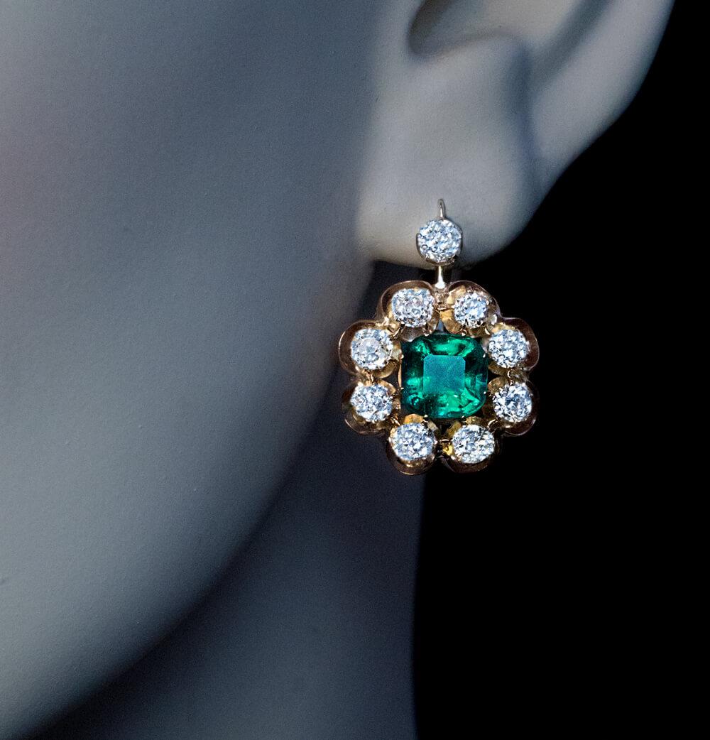 Russian, made in Saint Petersburg between 1908 and 1917.

The 14K gold cluster earrings feature two old mine cut cushion shape Colombian emeralds (1.35 ct and 1.14 ct) of excellent bluish green color. The stones are full of life and have great fire