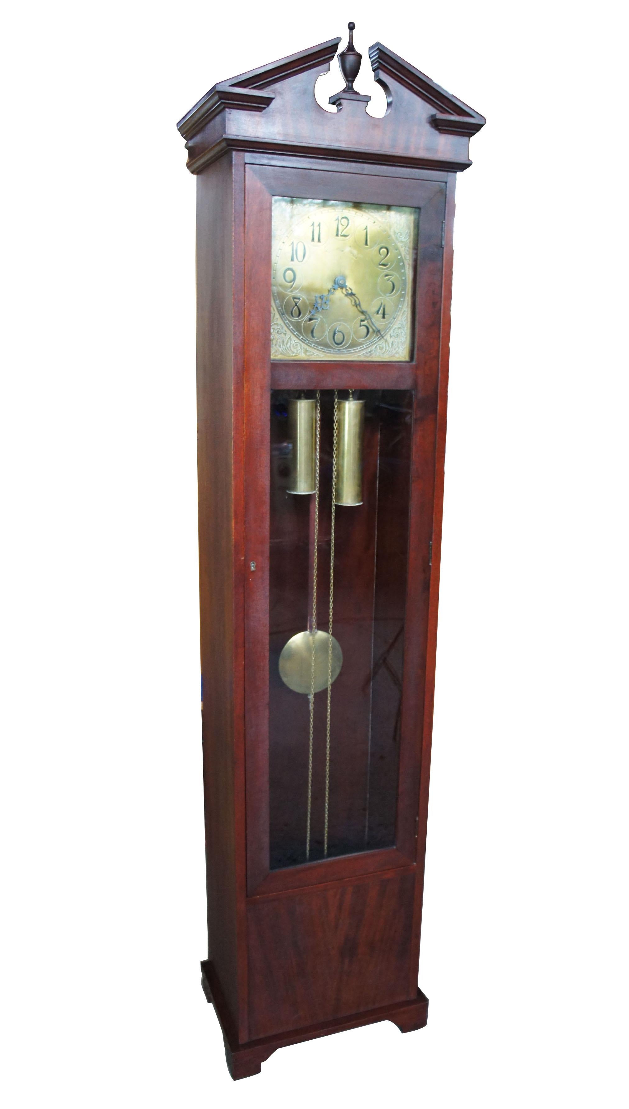 Antique Colonial Mfg Co Empire style mahogany grandfather clock German movement

Colonial manufacturing antique grandfather clock, circa 1920s. An empire style mahogany case with open pediment and trophy finial. The movement is stamped Germany.
