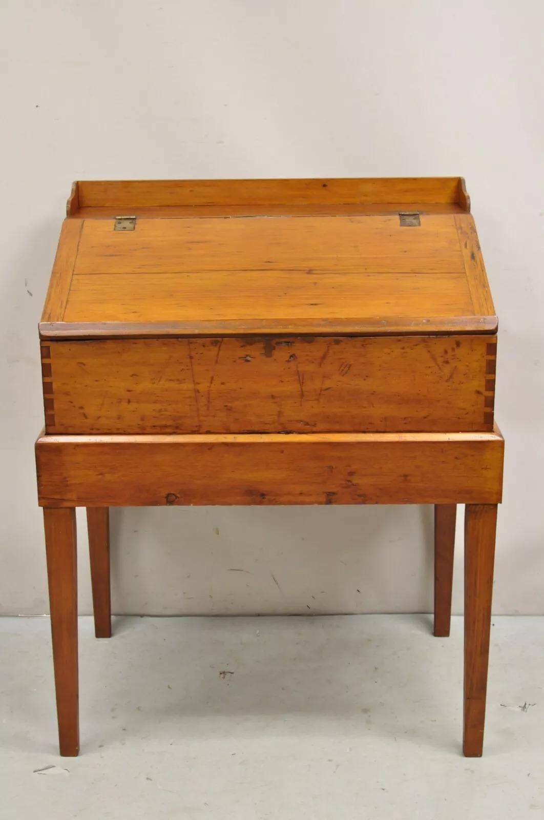 Antique Colonial Primitive Pine Wood Lift Top Schoolmaster's Storage Standing Desk with Dovetailed 2 Part Construction. Circa Late 19th Century. Measurements: 46.5