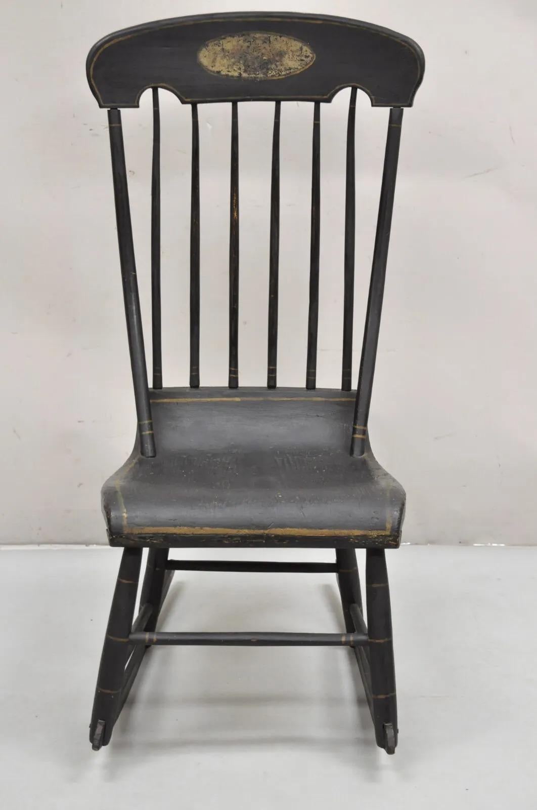 Antique Colonial Stencil Back Black Painted Plank Bottom Rocker Rocking Chair. Circa 19th Century. Measurements: 40