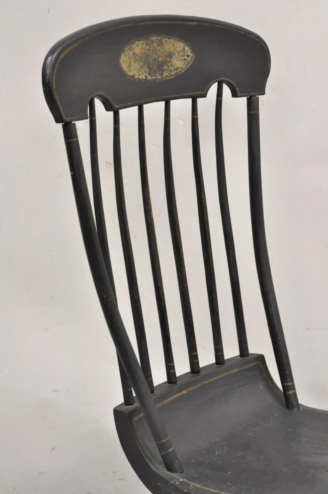 British Colonial Antique Colonial Stencil Back Black Painted Plank Bottom Rocker Rocking Chair For Sale