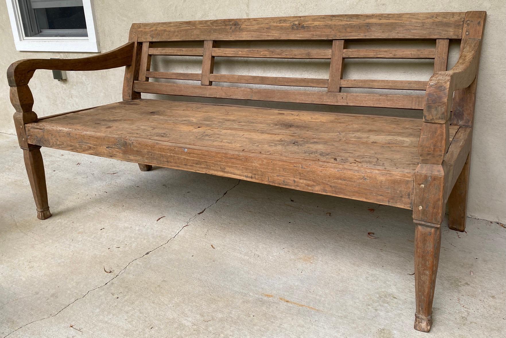This bench is made of solid teak wood and generally comes from farms developed by Dutch settlers in the early 20th century. Size of this bench allows above average size people to seat comfortably or used to recline for afternoon rest and relaxation.
