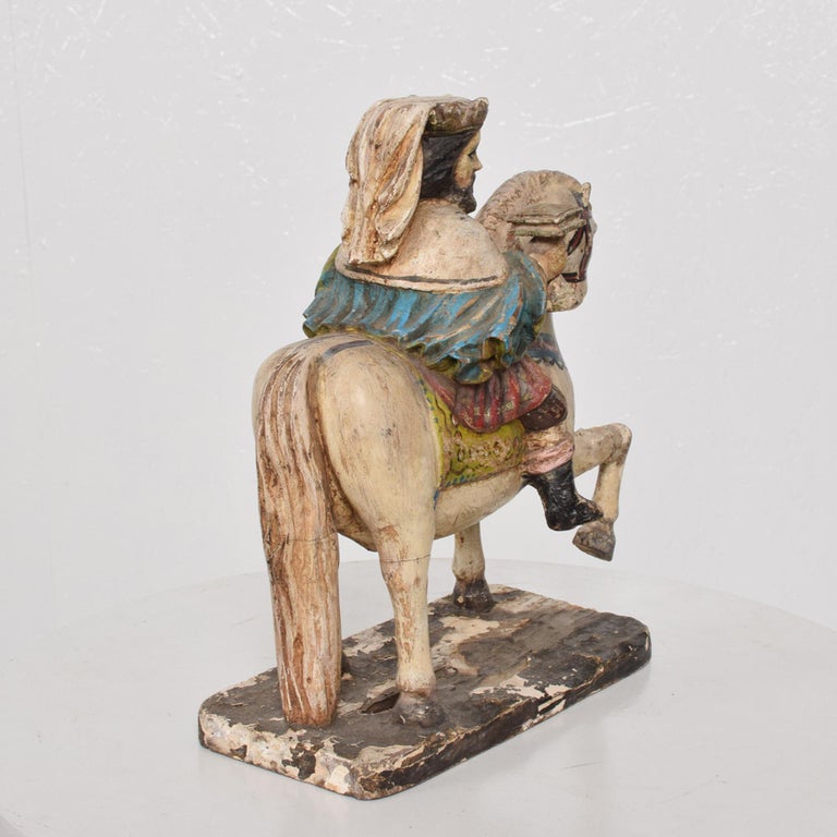 Late Victorian antique solid wood hand carved colorful statue figure art sculpture of majestic white horse with royal religious figure king mounted.
Presents as a beautifully hand painted horse and king carved in solid wood and decorated by
