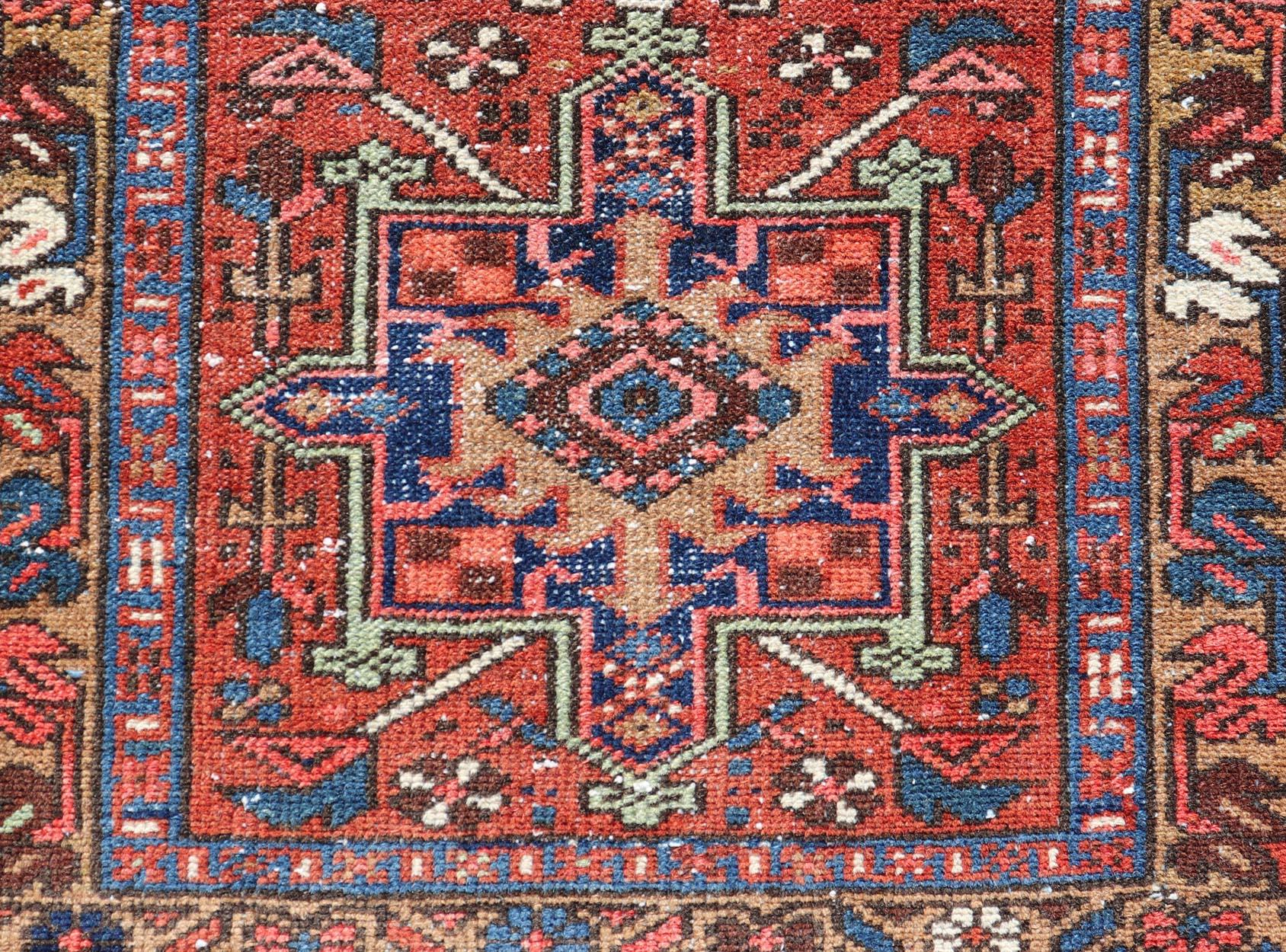 20th Century Antique Colorful Persian Heriz Rug with a Bold Geometric Design For Sale