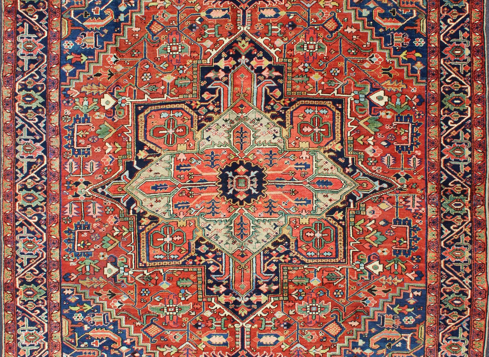 Colorful Antique Persian Heriz-Serapi With Geometric Medallion Design. Keivan Woven Arts / Rug / D-0907 / country of origin / type: Iran /Heriz, circa 1920's. 
Measures: 9'5 x 12'.
Made in the early 20th century, this charming Heriz-Serapi with a