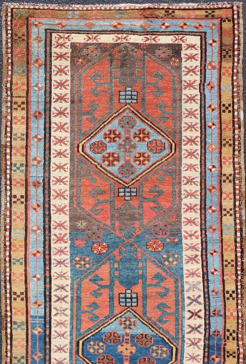 Antique colorful Persian Heriz-Serapi Runner with a bold Geometric design, Keivan Woven Arts / Rug/EMB-9693-P13532 
Made in the early 20th century, this charming Heriz-Serapi runner with large medallions, has an array of cheerful and bright colors.