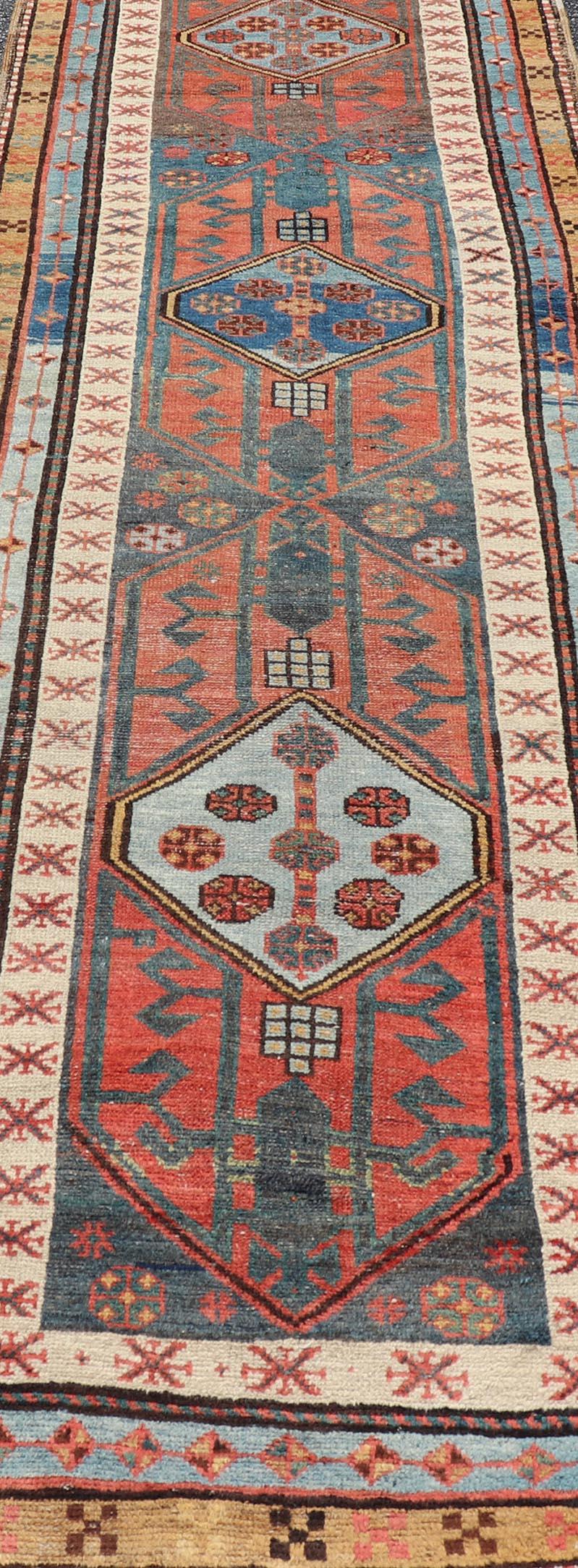 20th Century Antique Colorful Persian Heriz-Serapi Runner with a Bold Geometric Design For Sale