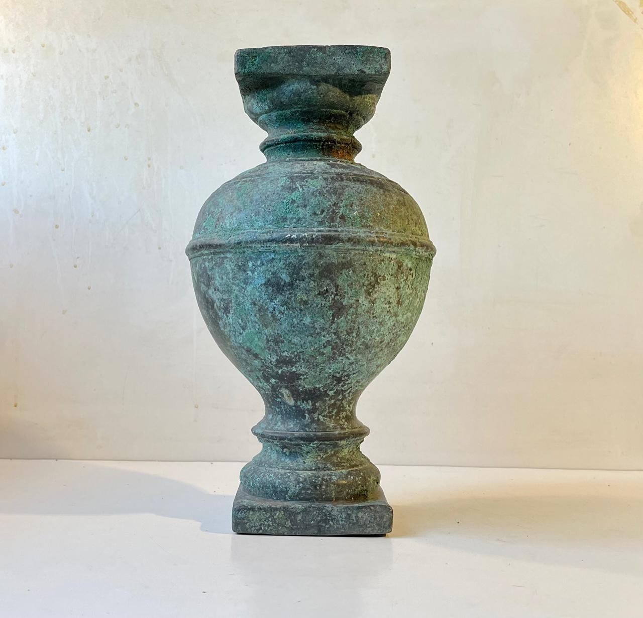 A 19th century architectural ornament in the shape of a column or pedestal. Its fashioned from solid bronze weighing in excess of 15 kg. It has patinated beautifully over the spand of time into a cascade of vibrant greens. Use it as a plant stand