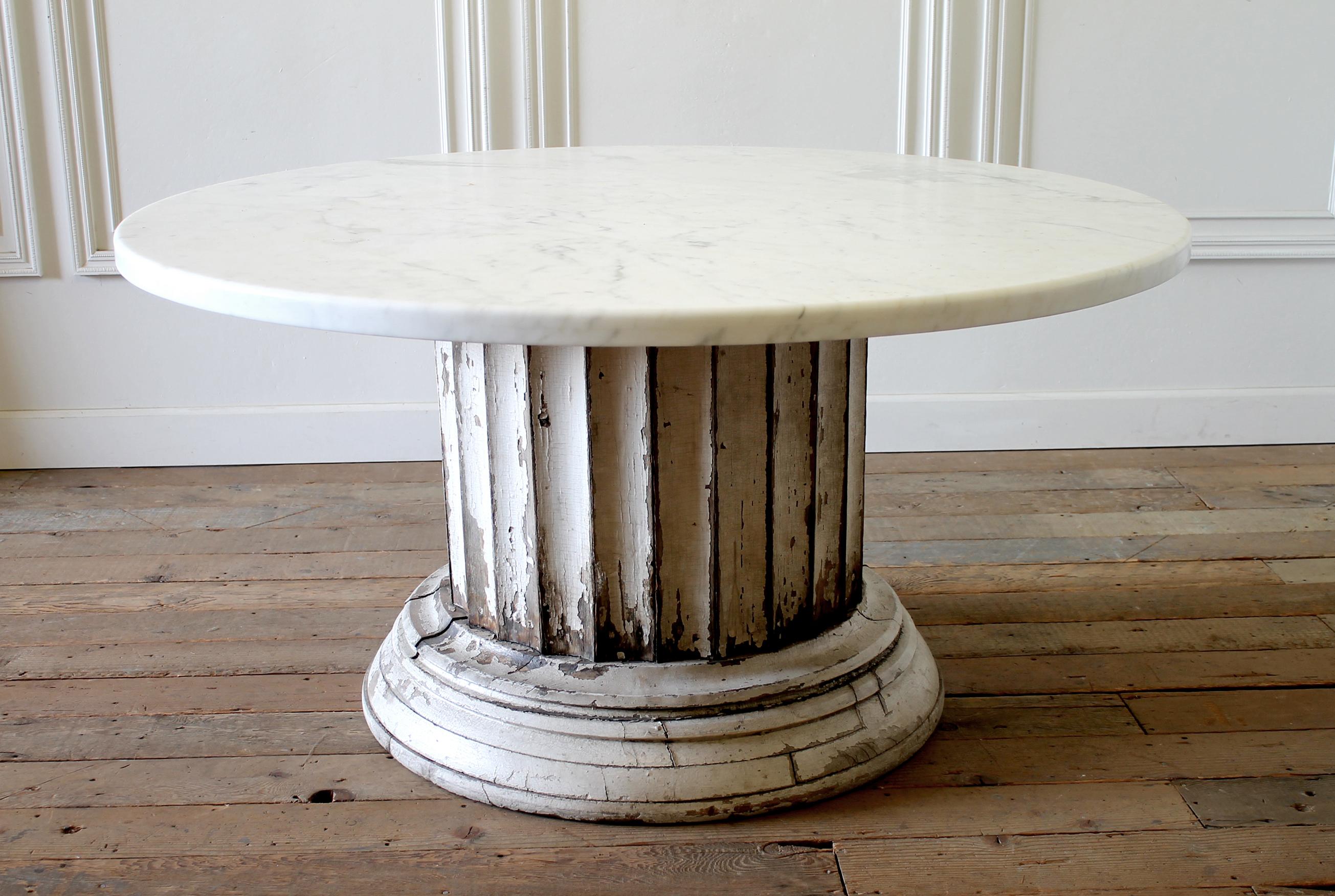 Antique column pedestal dining table original paint Calcutta gold marble top
150 year old column base salvaged from a home in CT. This column was 50 ft. tall originally, we purchased this column to have it cut down into a dining table