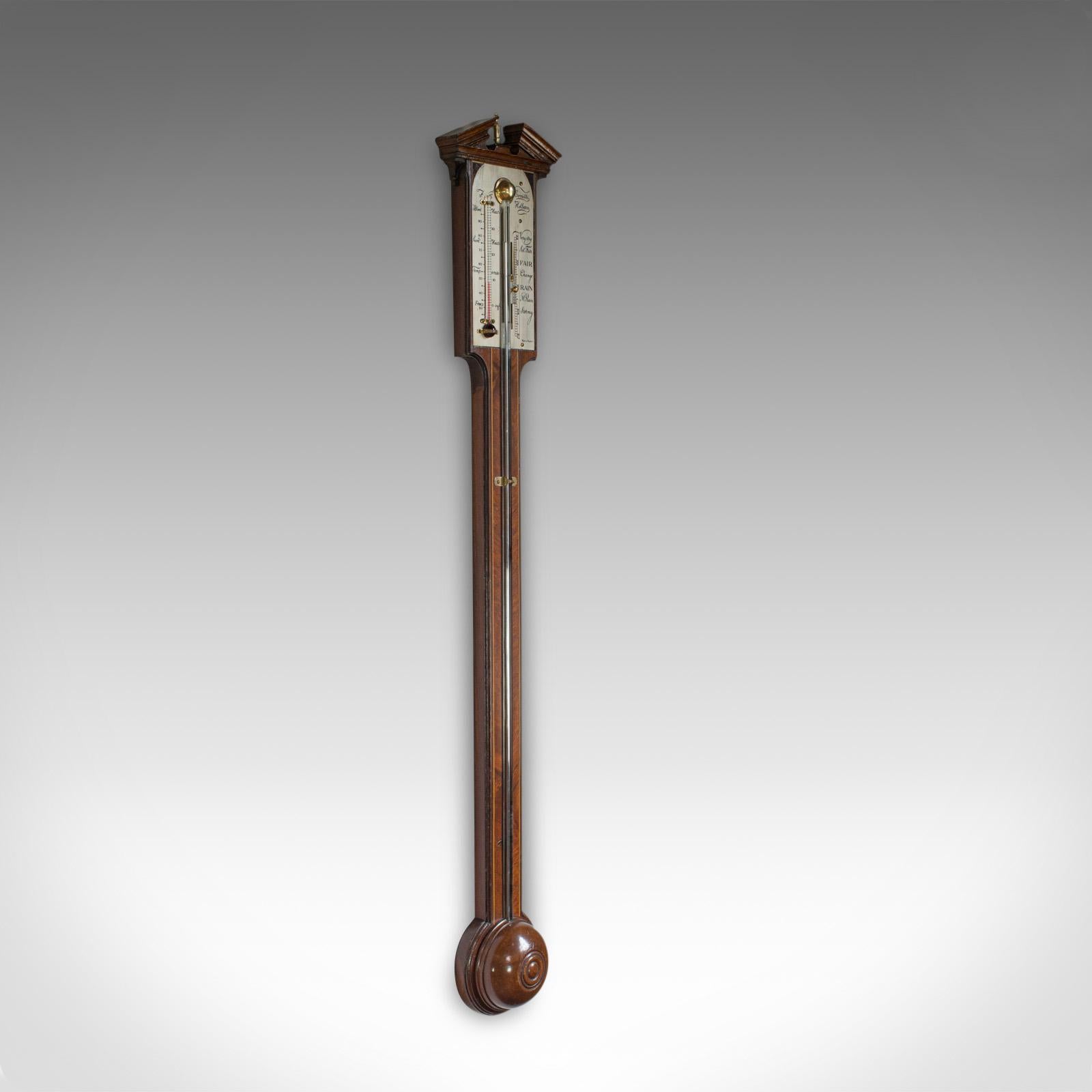 This is an antique Comitti stick barometer. An English, rosewood and mahogany feather fan barometer dating to the early 20th century, circa 1910.

Select cuts of rosewood display rich hues throughout
Displays a desirable aged patina
Original