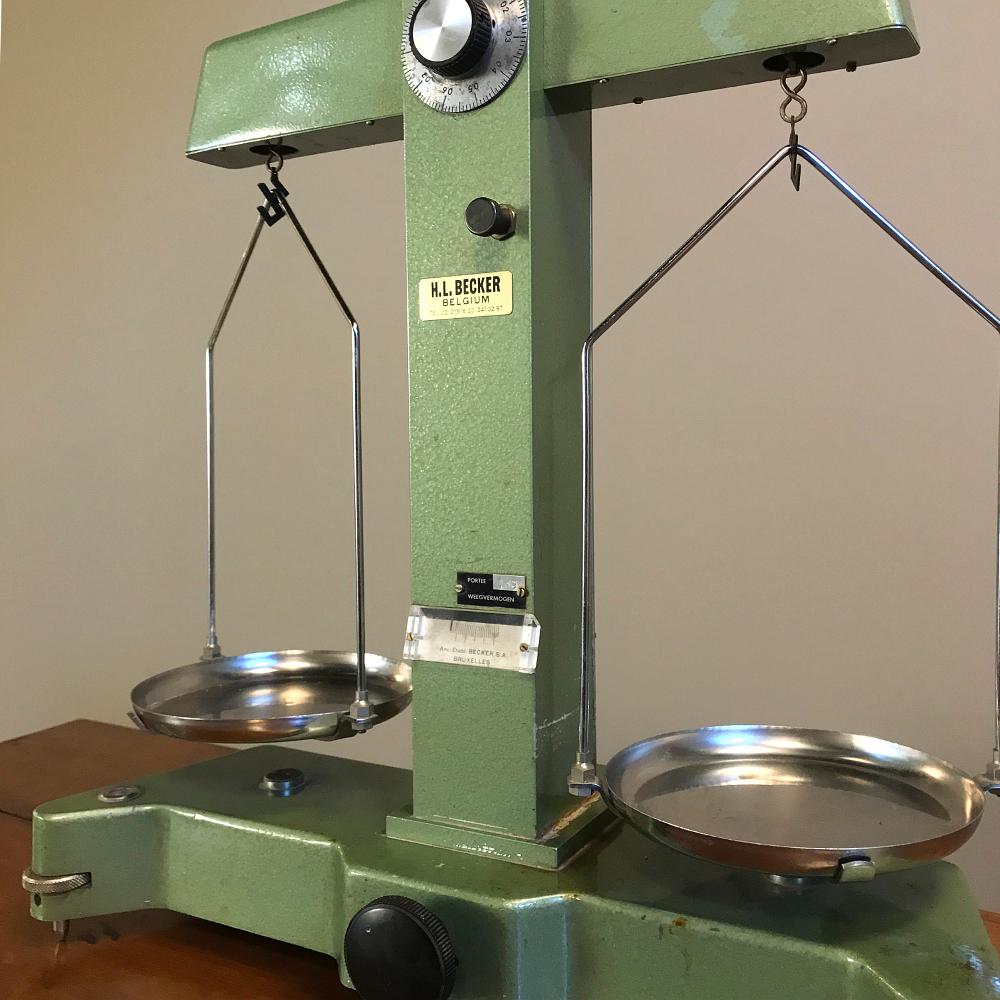 Antique commercial balance scale by H. L. Becker in Brussels is the type of precision instrument for which the company was known during the early 20th century. Note the attention to detail and leveling mechanism as well as the precision of the