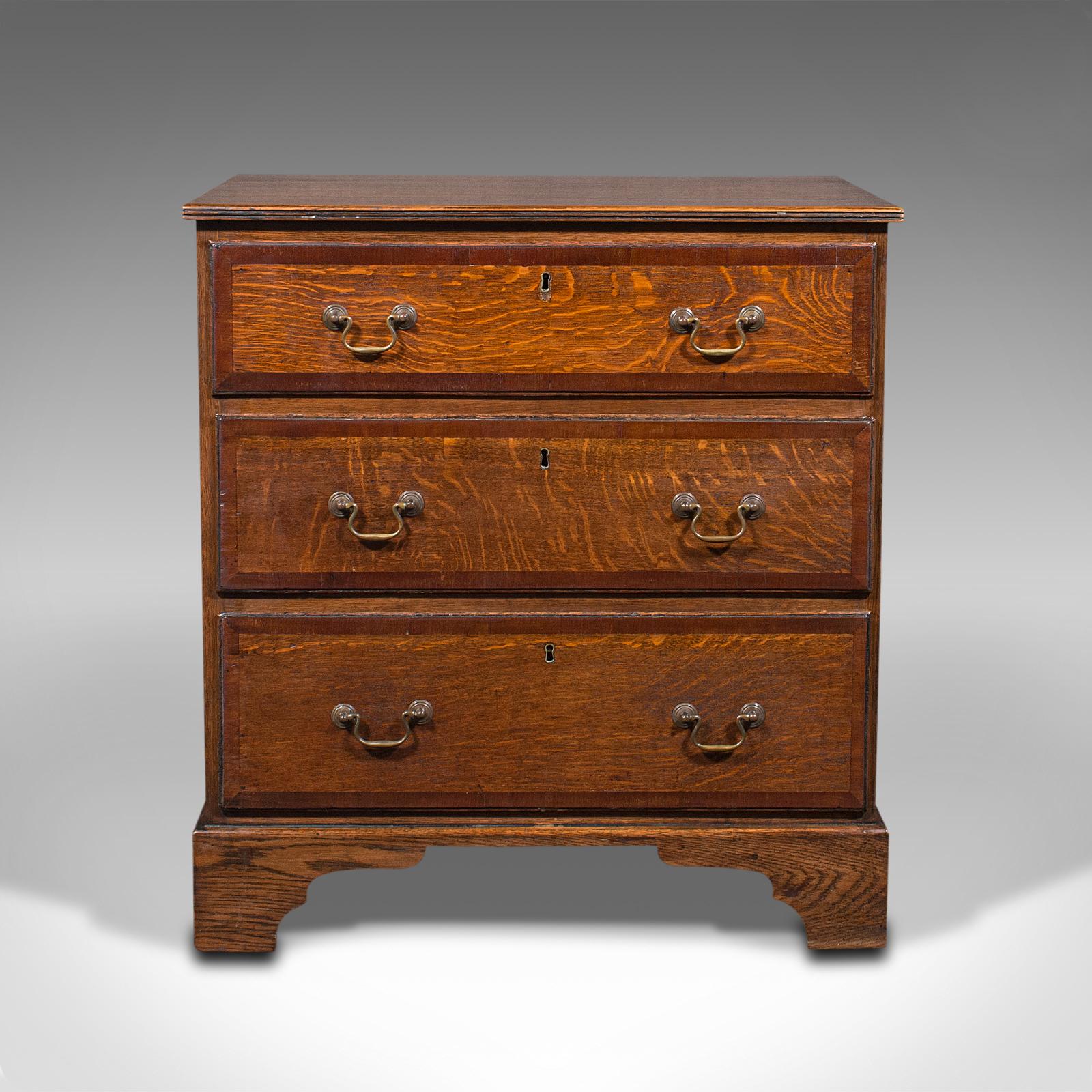 This is an antique compact chest of drawers. An English, oak bedside cabinet, dating to the Georgian period, circa 1800.

Striking antique chest of drawers with eye-catching figuring
Displays a desirable aged patina and in good order
Select oak