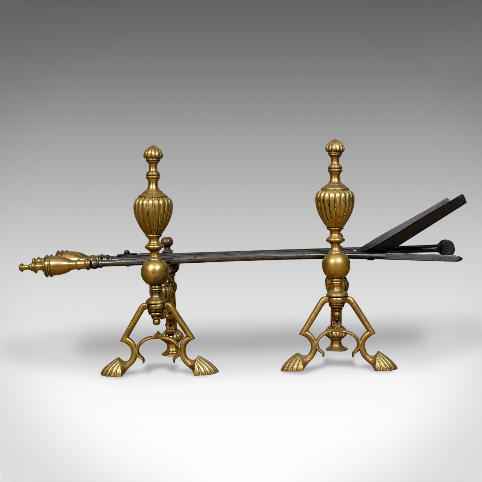 This is an antique companion set of fire-irons on rests. An English, Victorian, classical revival, set of fire tools in brass and iron and dating to the late 19th century, circa 1880.

Attractive handwrought ironwork tools
A poker, shovel and