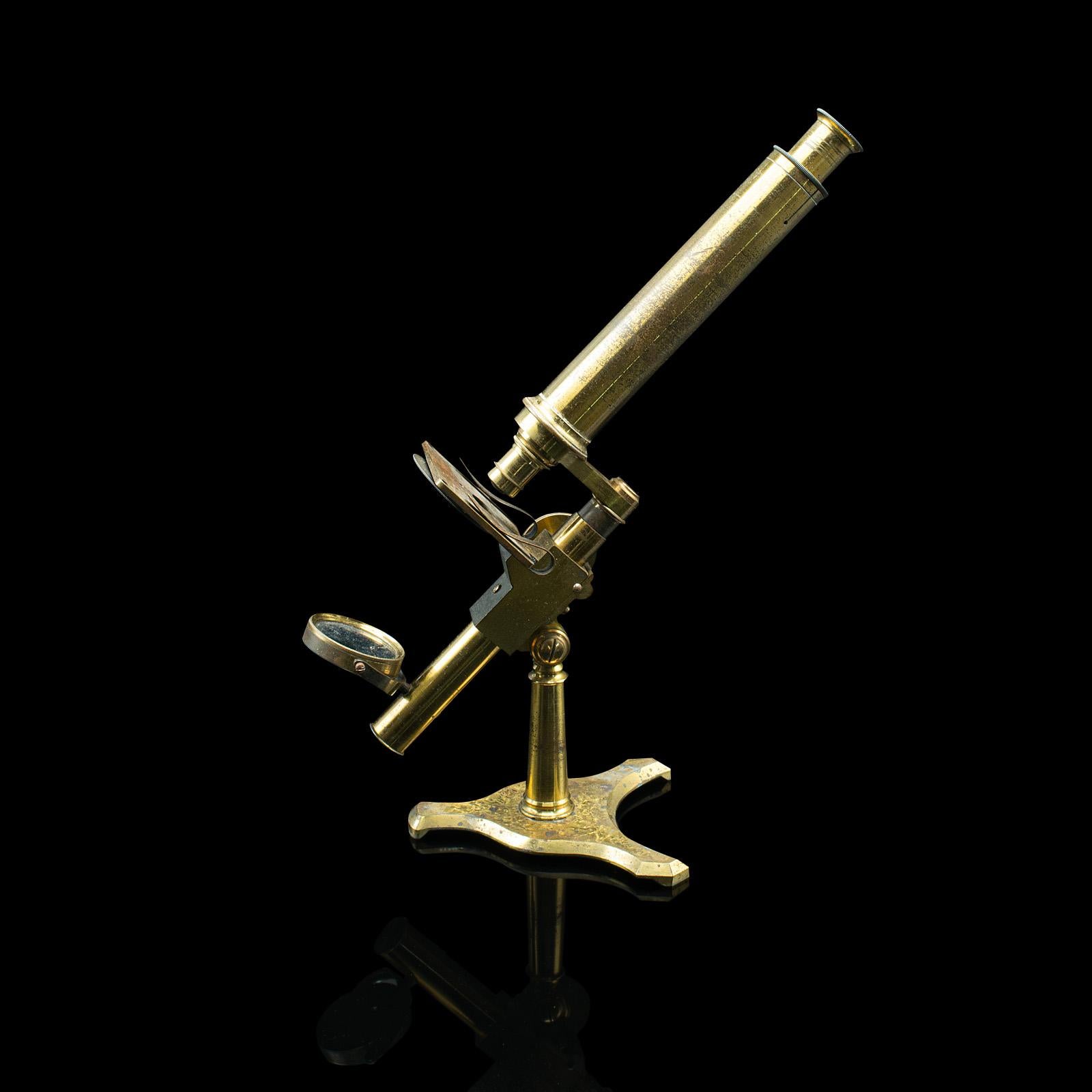 This is an antique compound microscope. An English, brass instrument within a mahogany case by Negretti & Zambra, dating to the Victorian period, circa 1870.

Delightful portable microscope with a quality case and modular build
Displays a