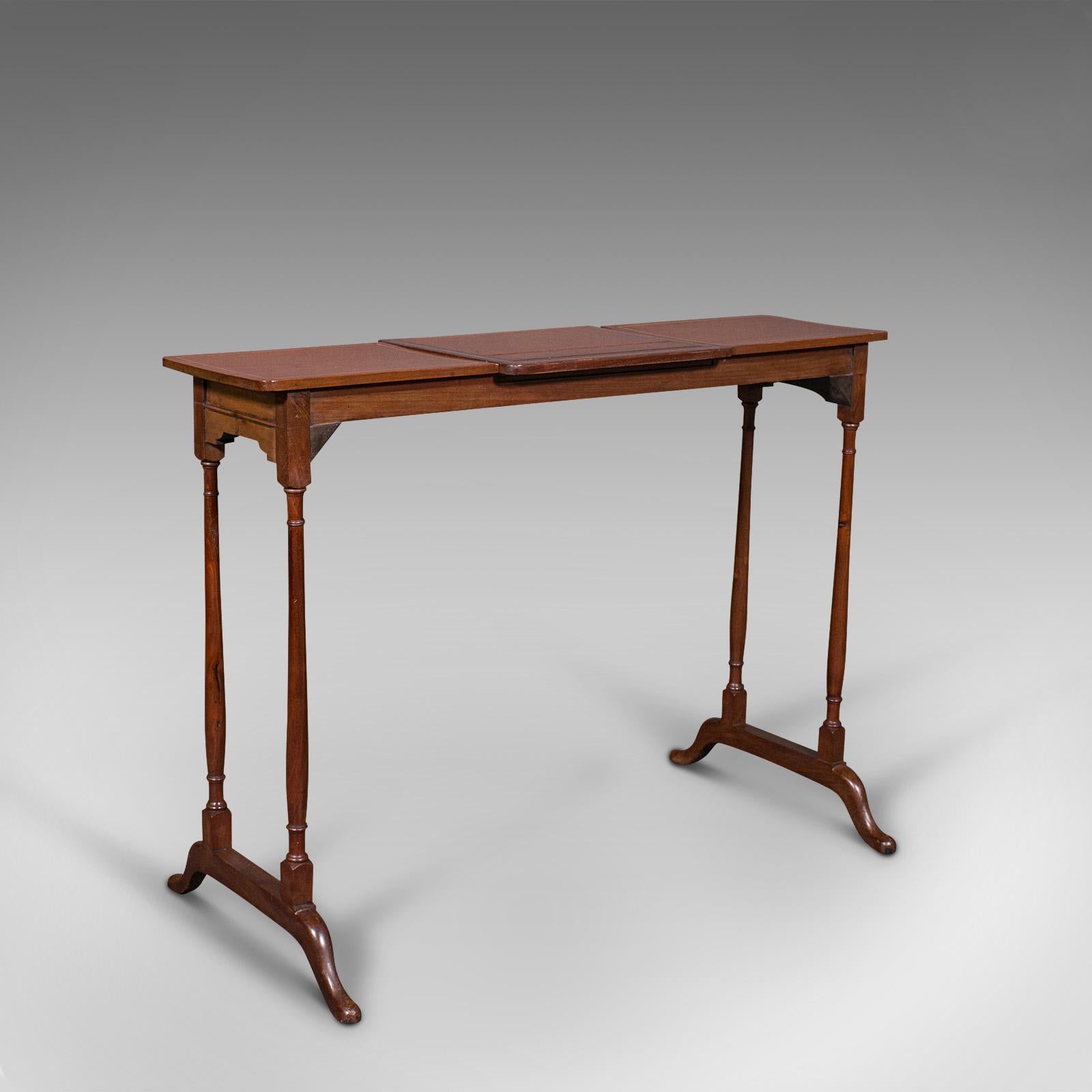 This is an antique conductor's stand. An English, mahogany adjustable music rest or lectern, dating to the Edwardian period, circa 1910.

Elegantly presented stand, ideal for public recitals or speeches
Displays a desirable aged patina and in