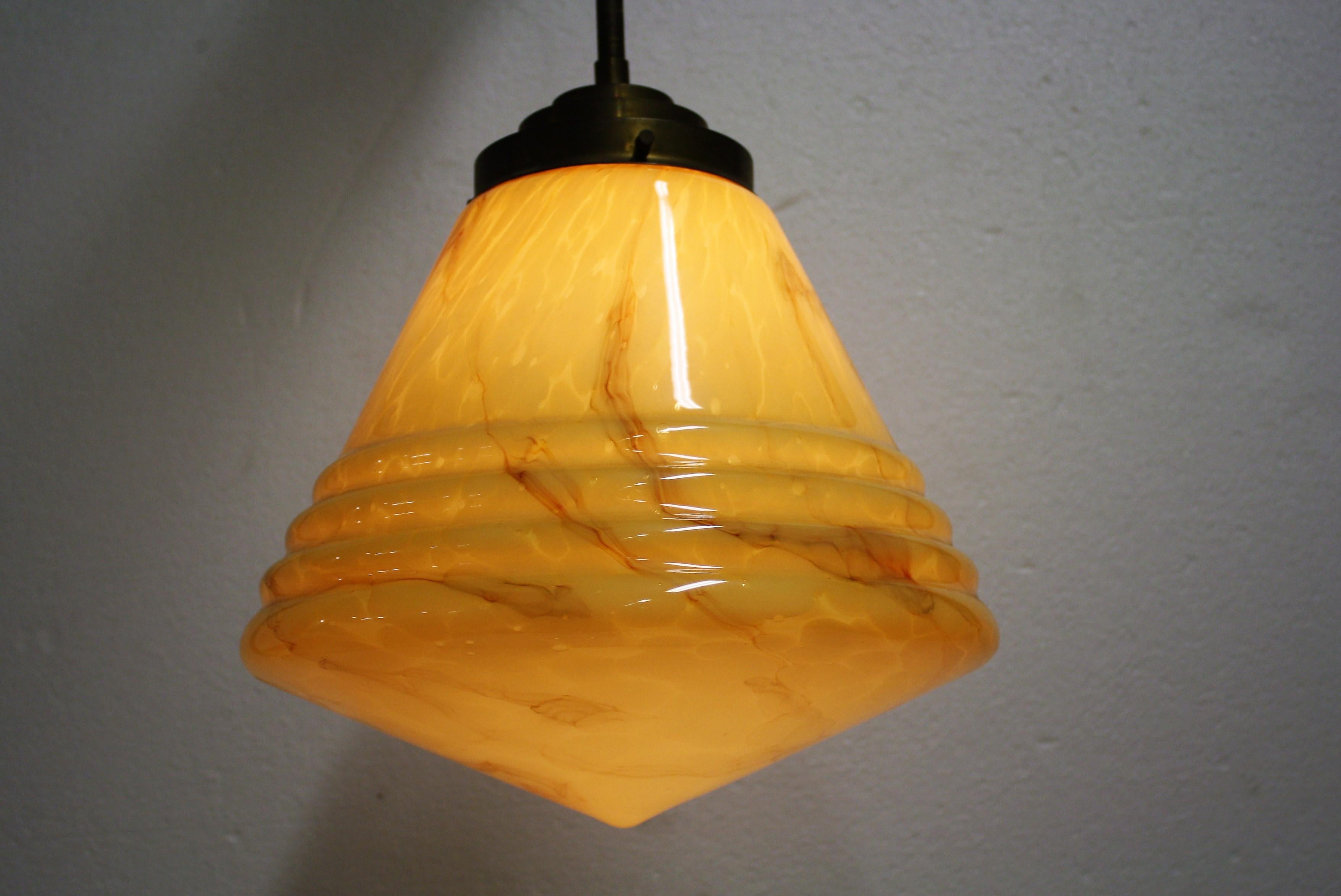 Antique conical shaped marbled glass pendant light.

The lamp is suspended by the original stepped copper shade holder. 

This type of lamp used to be installed in public spaces such as schools, offices, from the 1930s to the 1960s. 

The lamp