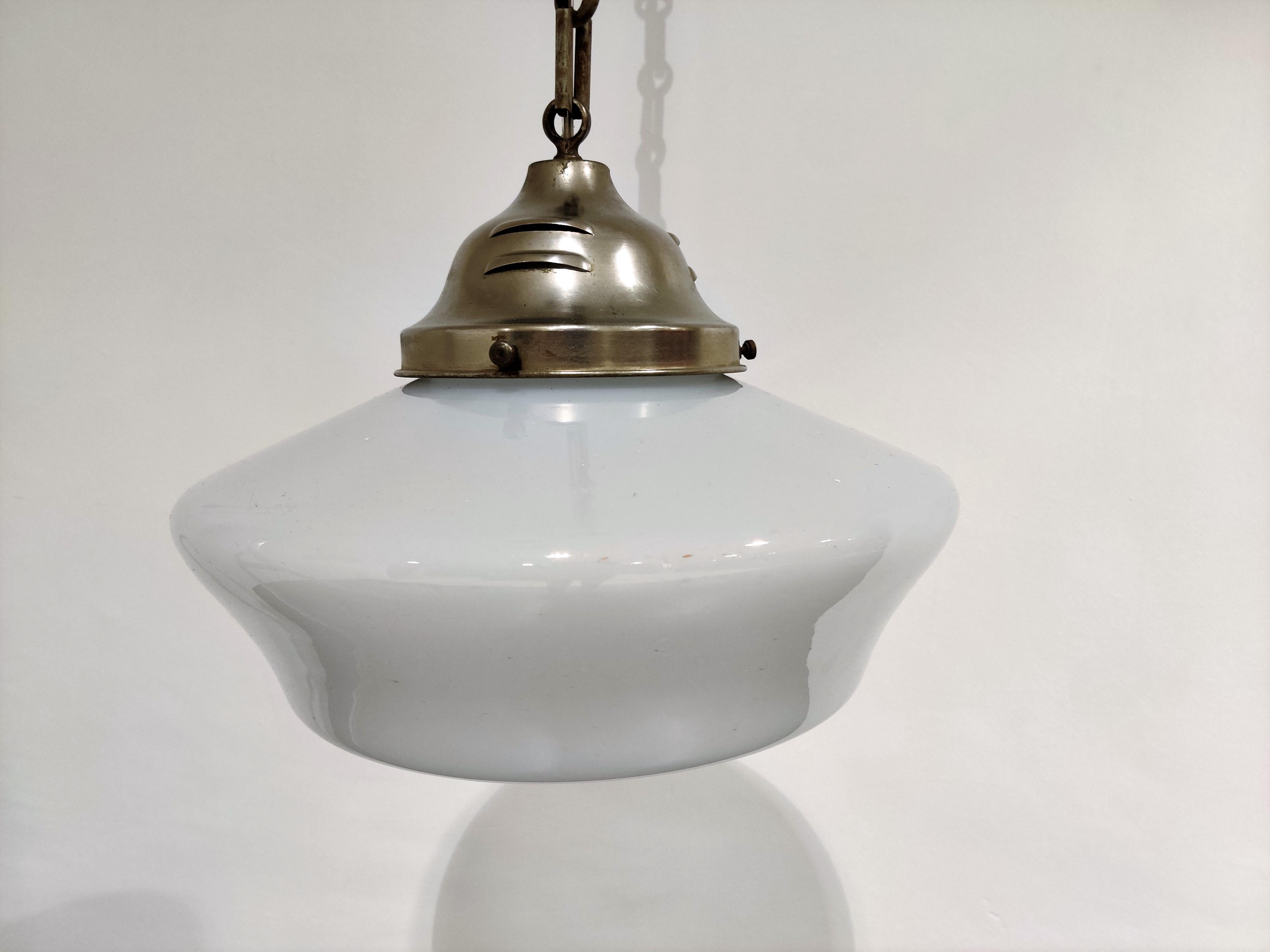 Antique conical shaped Art Deco hallway pendant light.

These lamps are very typical for the Art Deco era and were widely used to be hung in hallways, offices or larger public places.

The lamp havethe original copper share holder and ceiling