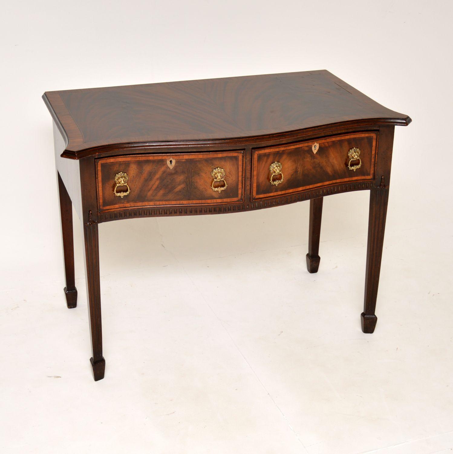 A fantastic antique side table in a beautifully rich flame wood. This was made in England, it dates from around the 1900-1910 period.

It is of amazing quality with generous proportions and a good amount of storage space inside the two deep