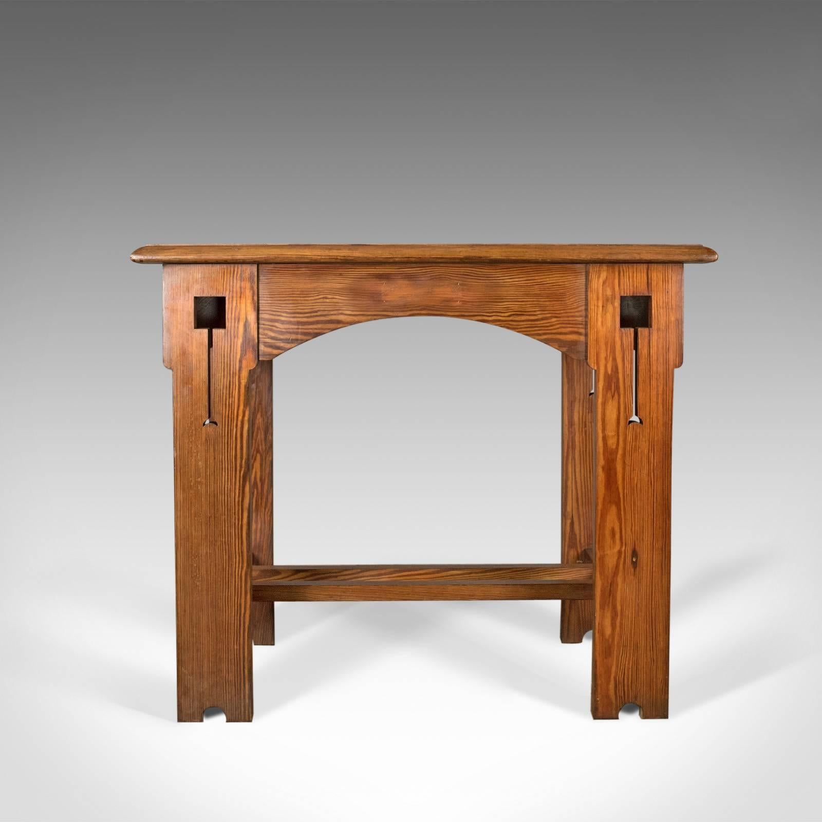 This is an antique console table, an English, Arts & Crafts, Victorian pine side table dating to circa 1880.

A delightful Arts & Crafts console table with ecclesiastic overtones
In pitch pine displaying good color and grain interest
Of quality