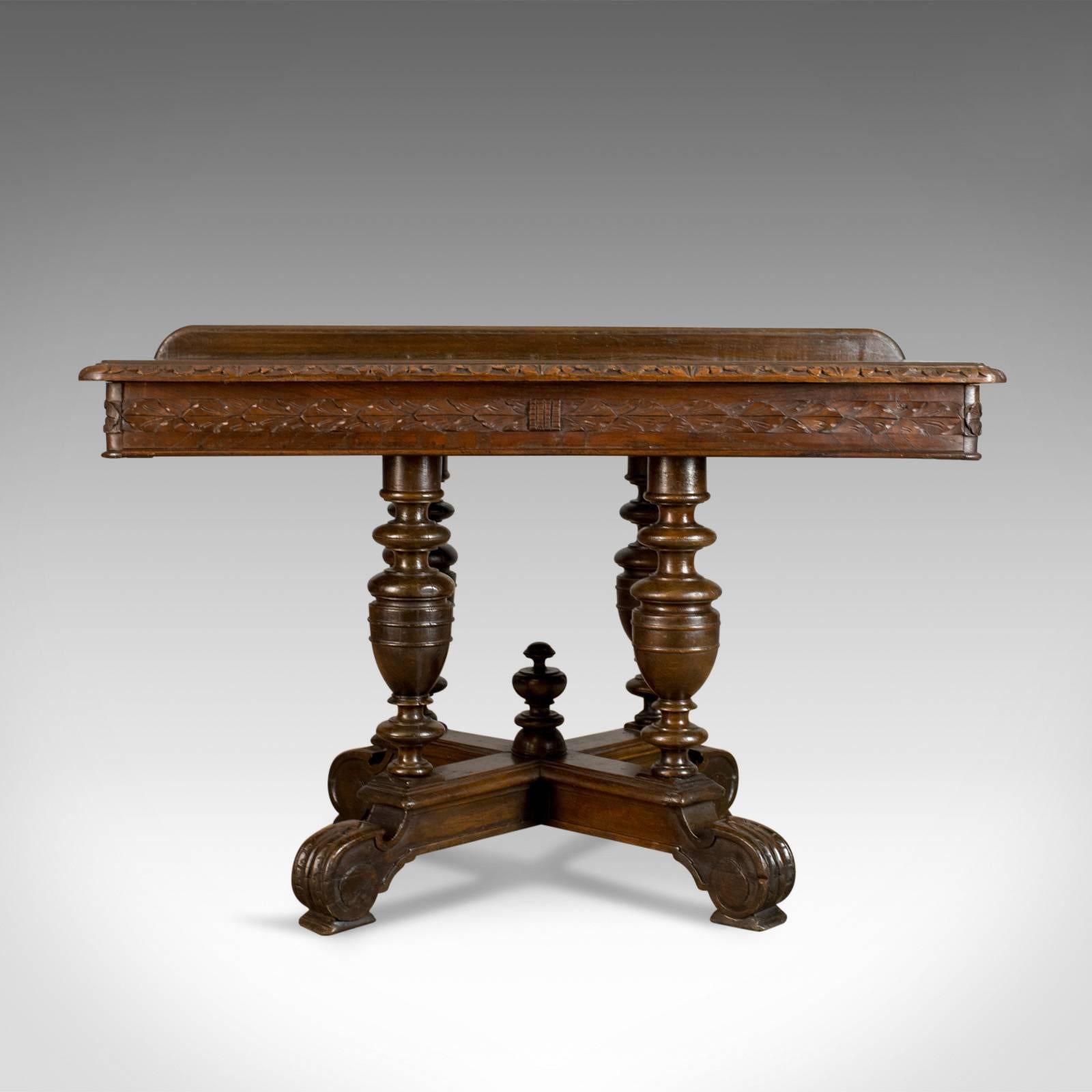 This is an antique console table, an English, oak, Victorian side table dating to the late 19th century, circa 1880.

Deep, rich tones to the dark English oak
Grain interest and a desirable aged patina
Up-stand and rear projection, ideal for