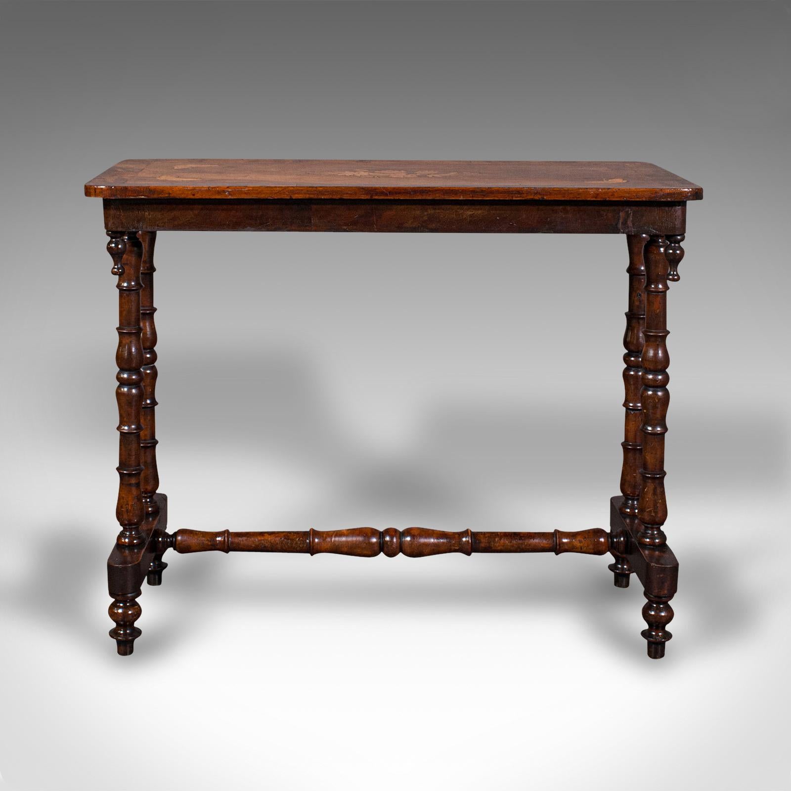 This is an antique console table. An English, walnut and boxwood inlaid decorative side or occasional table, dating to the Regency period, circa 1830.

Delicate craftsmanship and attractive finish
Displays a desirable aged patina