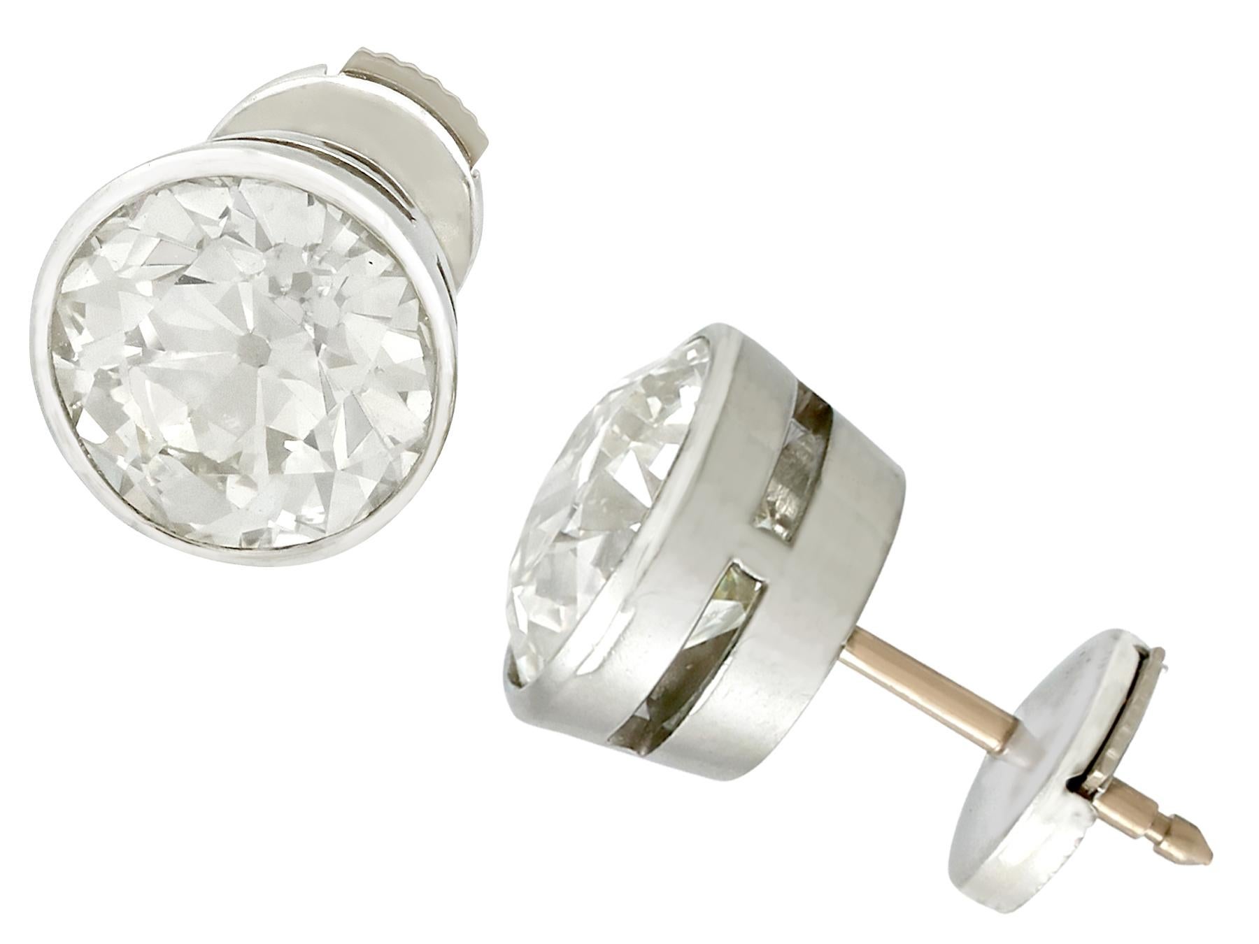 A stunning pair of contemporary 18k white gold stud earrings set with 6.10cts of antique (circa 1900) diamond; part of our diverse antique jewellery and estate jewelry collections.

These stunning, fine and impressive antique 6.10ct diamond stud