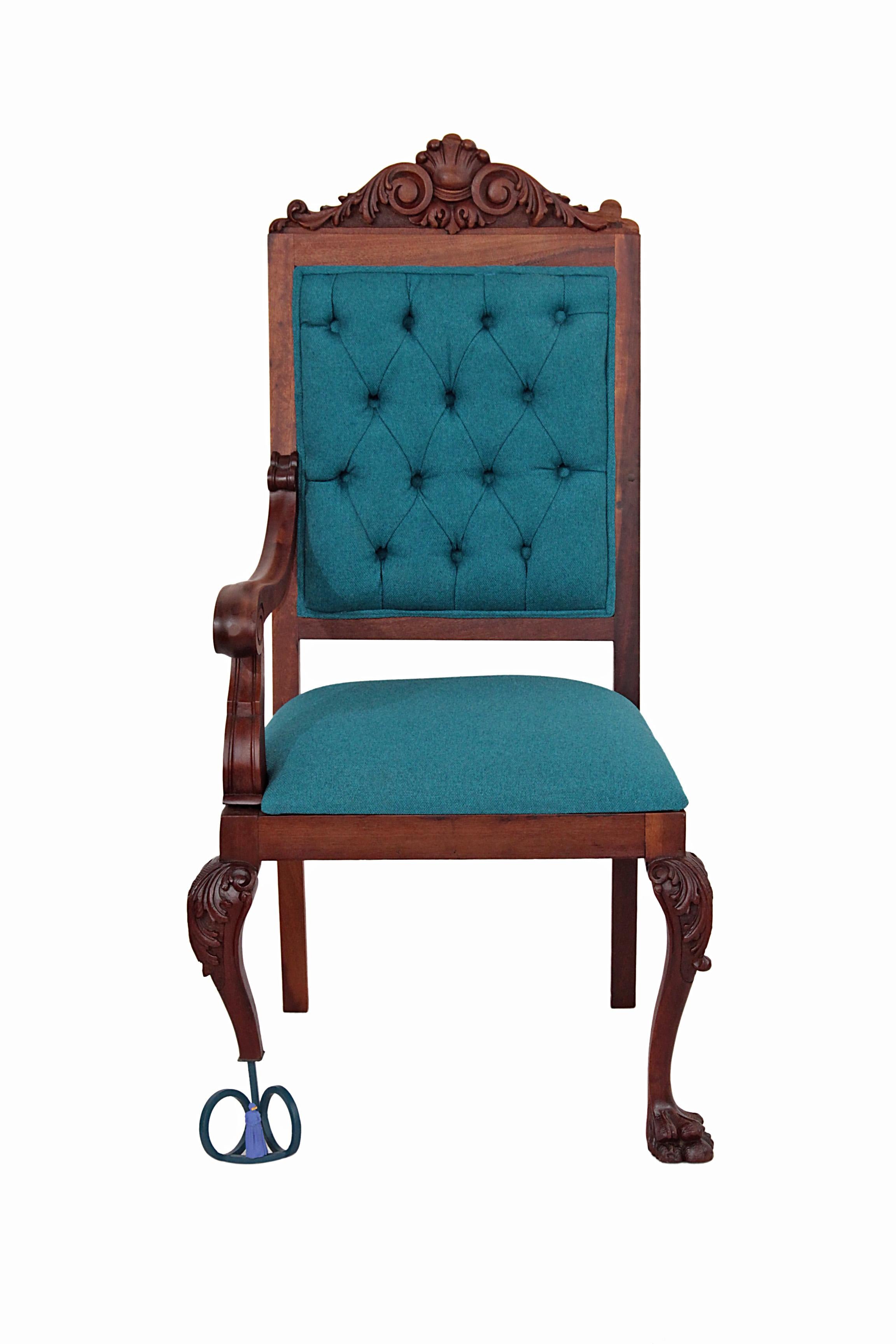 This antique contemporary armchair - Restauro #1 (Restoration #1) is an antique Brazilian walnut armchair rescued and restored with blue fabric, antique looking brass handles and blue steel base for one leg, in which is one 3D printed small statue.