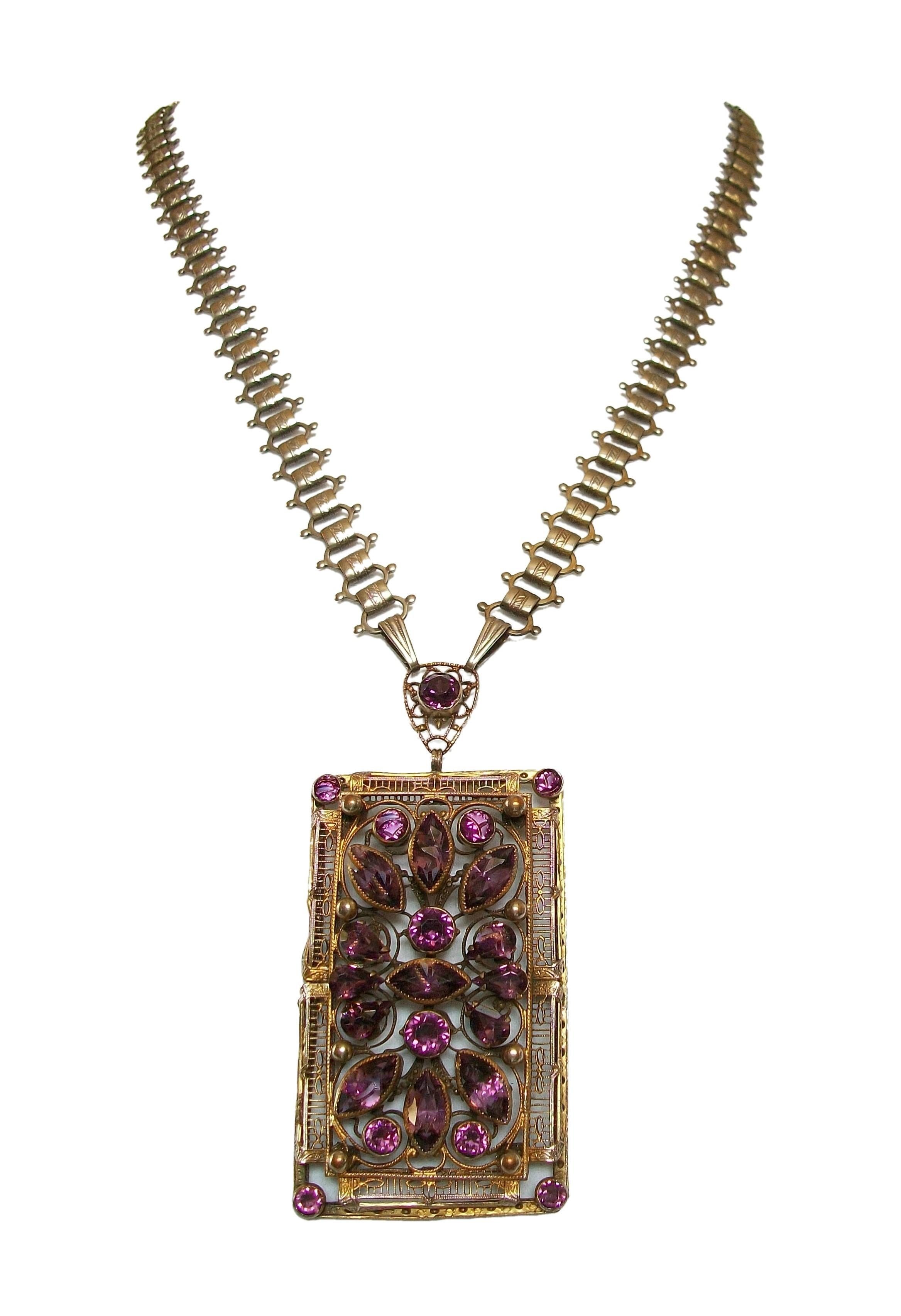 Antique Victorian amethyst paste pendant and chain - rare quality period piece - large and dramatic size - the pendant set with various marquis and round shaped purple amethyst glass stones - all set on a gilded filigree backing with tooled frame -