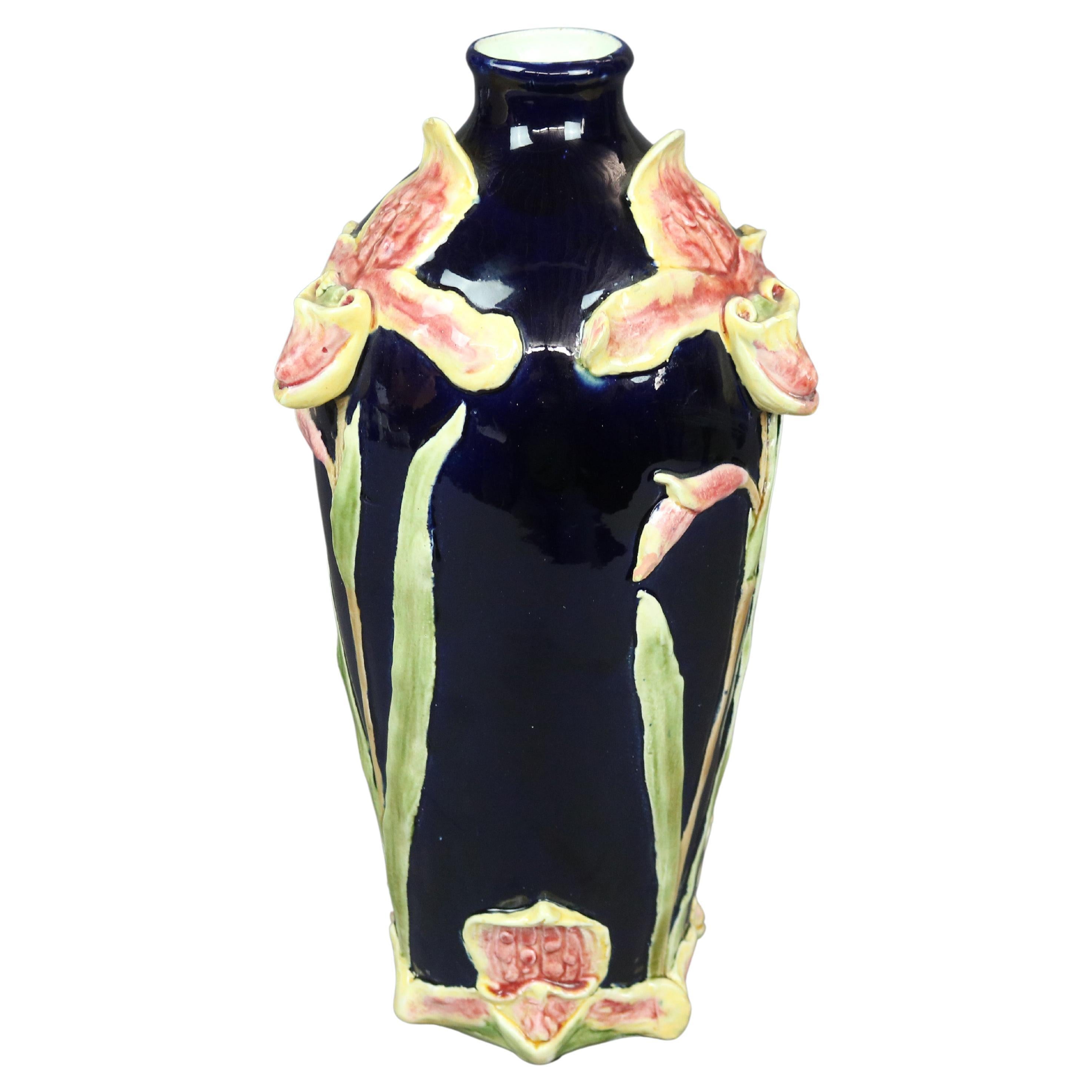 An antique continental Majolica vase offers art pottery construction with lilies in relief, circa 1900

Measures - 14