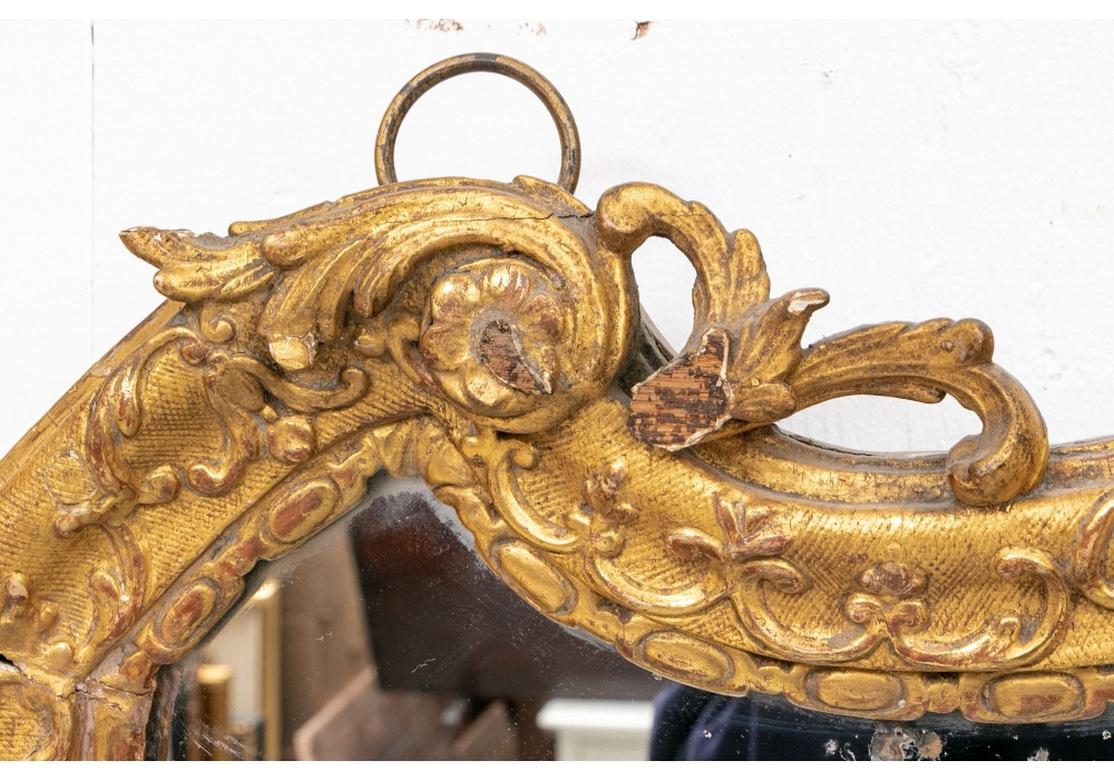 Antique Continental Carved and Gilt Cartouche Form Mirror In Fair Condition In Bridgeport, CT