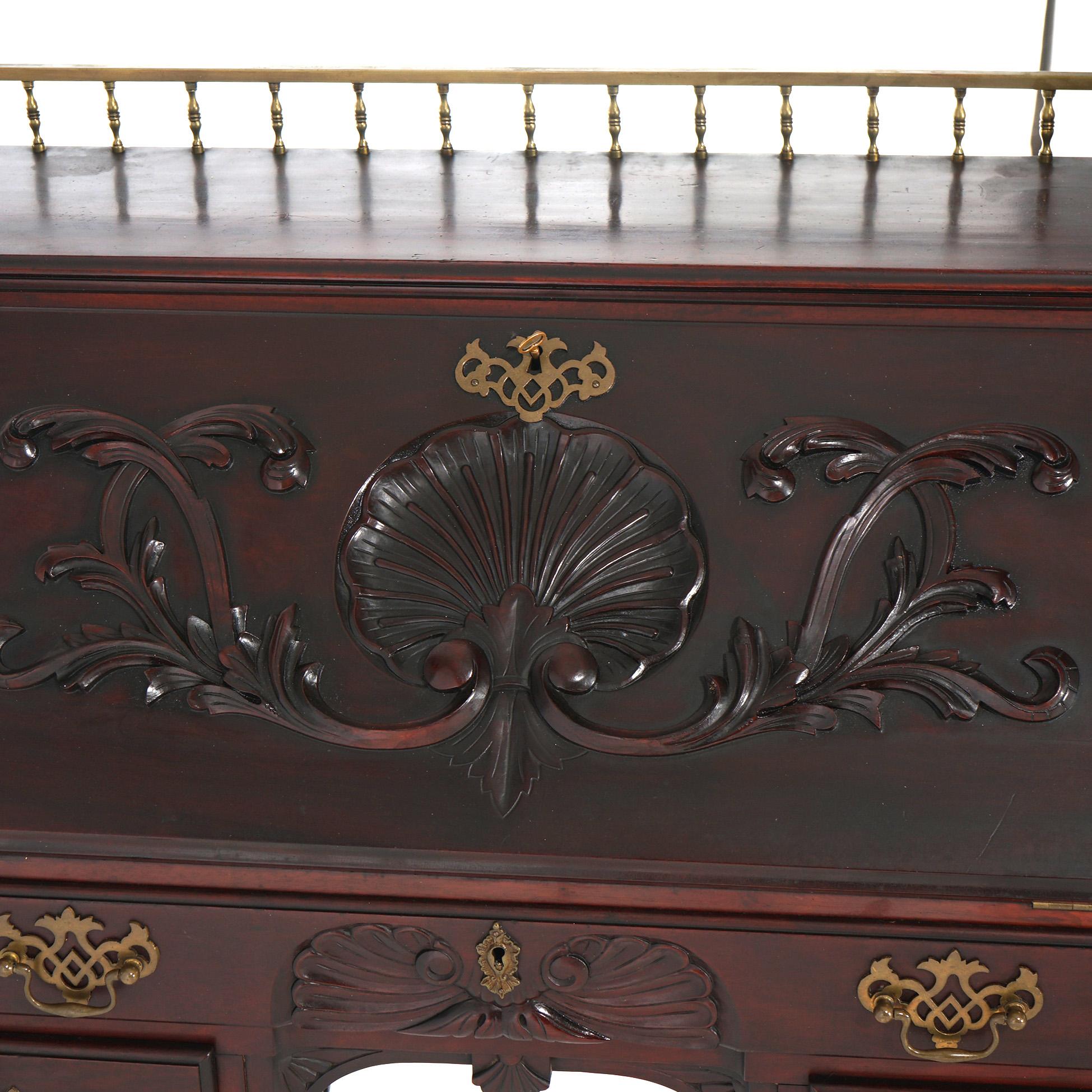 An antique Continental Chippendale desk offers upper gallery over drop front desk having carved foliate decoration and opening to interior with storage writing surface and storage compartments, lower case with drawer, raised on cabriole legs
