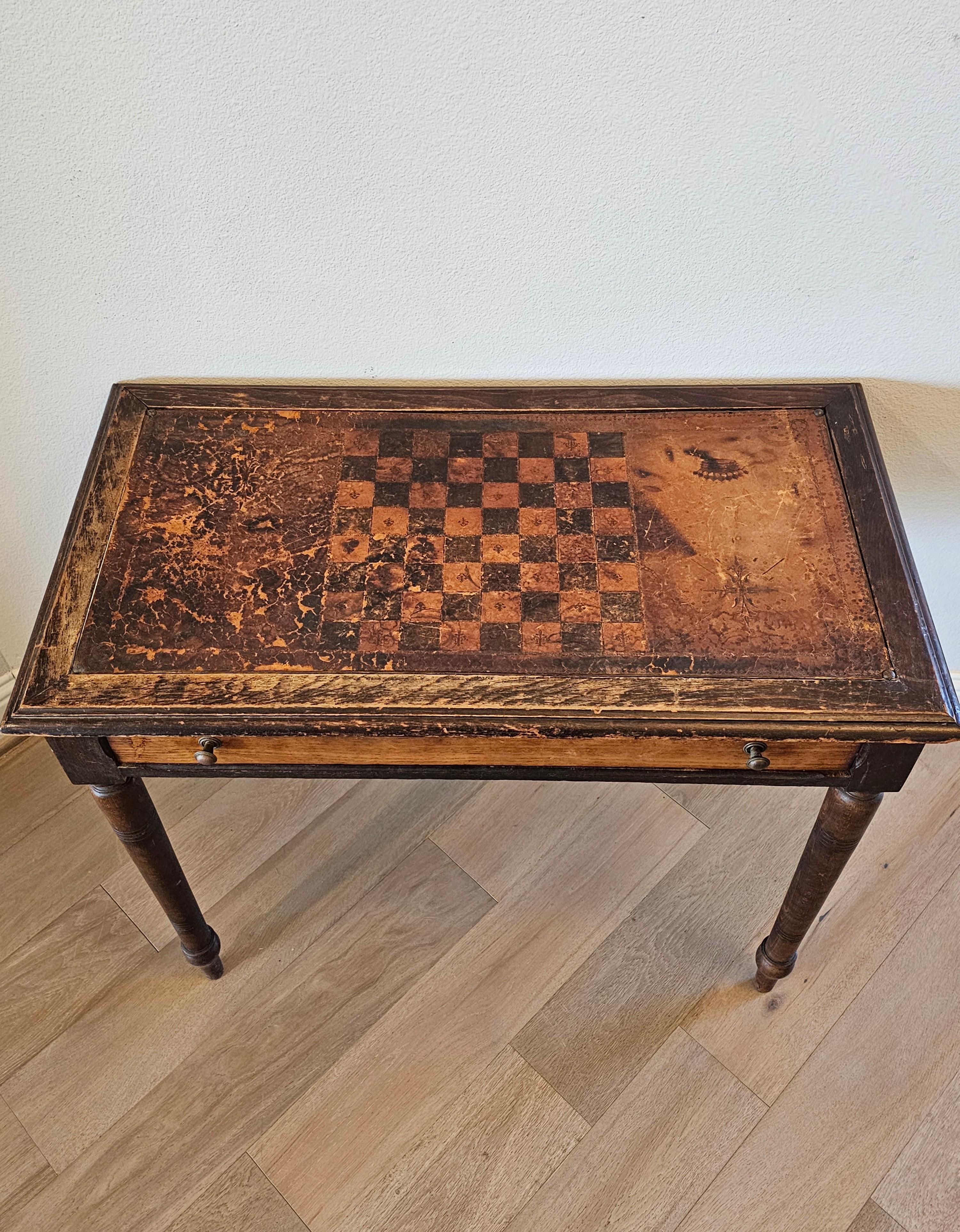 Add authentic old world European character and charm with this distinctive antique writing table / games table with beautifully aged warm rustic heavily distressed patina. 

Born in Continental Europe in the 19th century, hand-crafted of solid pine