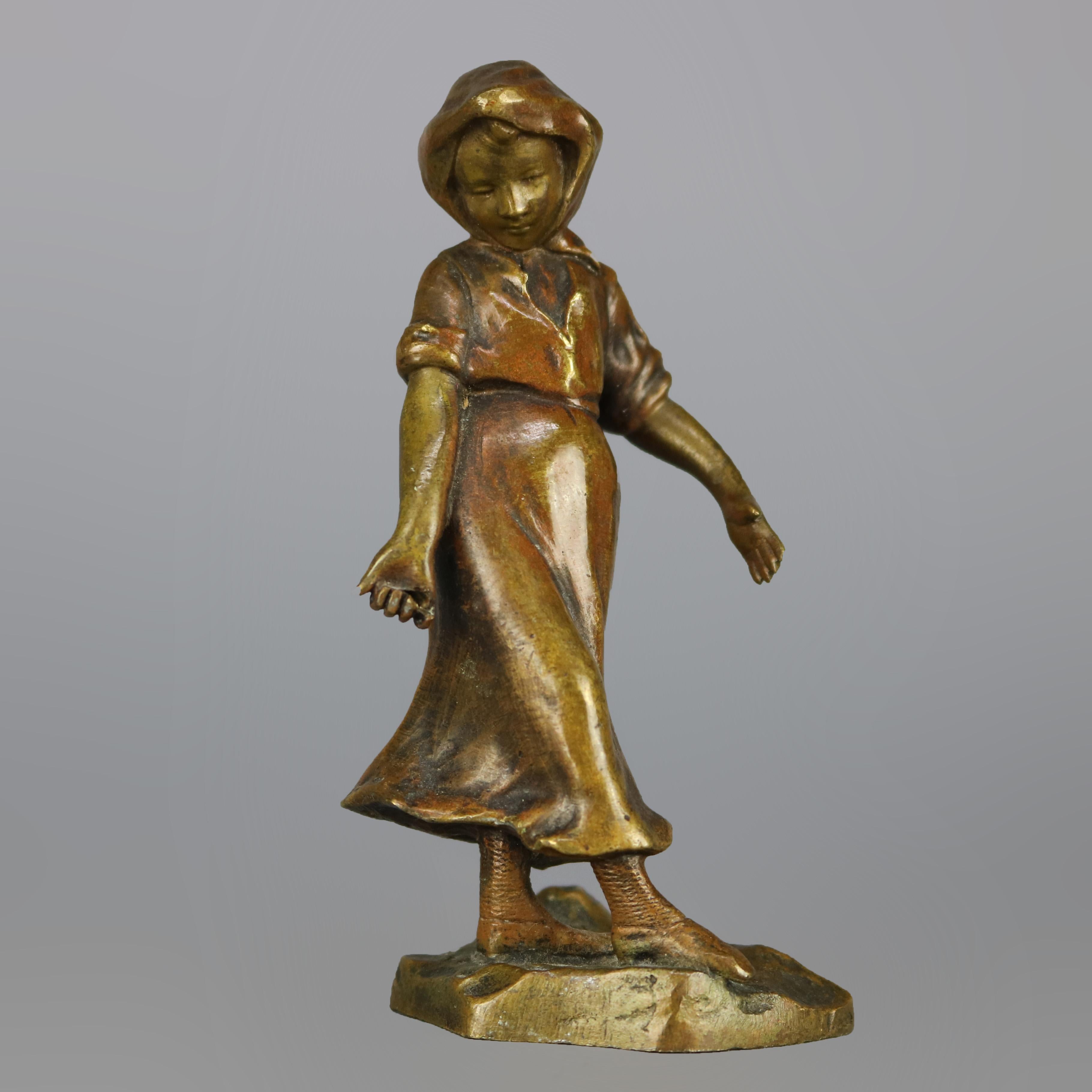An antique continental figural cabinet sculpture offers cast bronze construction and depicts young barefoot girl walking in countryside setting, circa 1900

Measures: 4