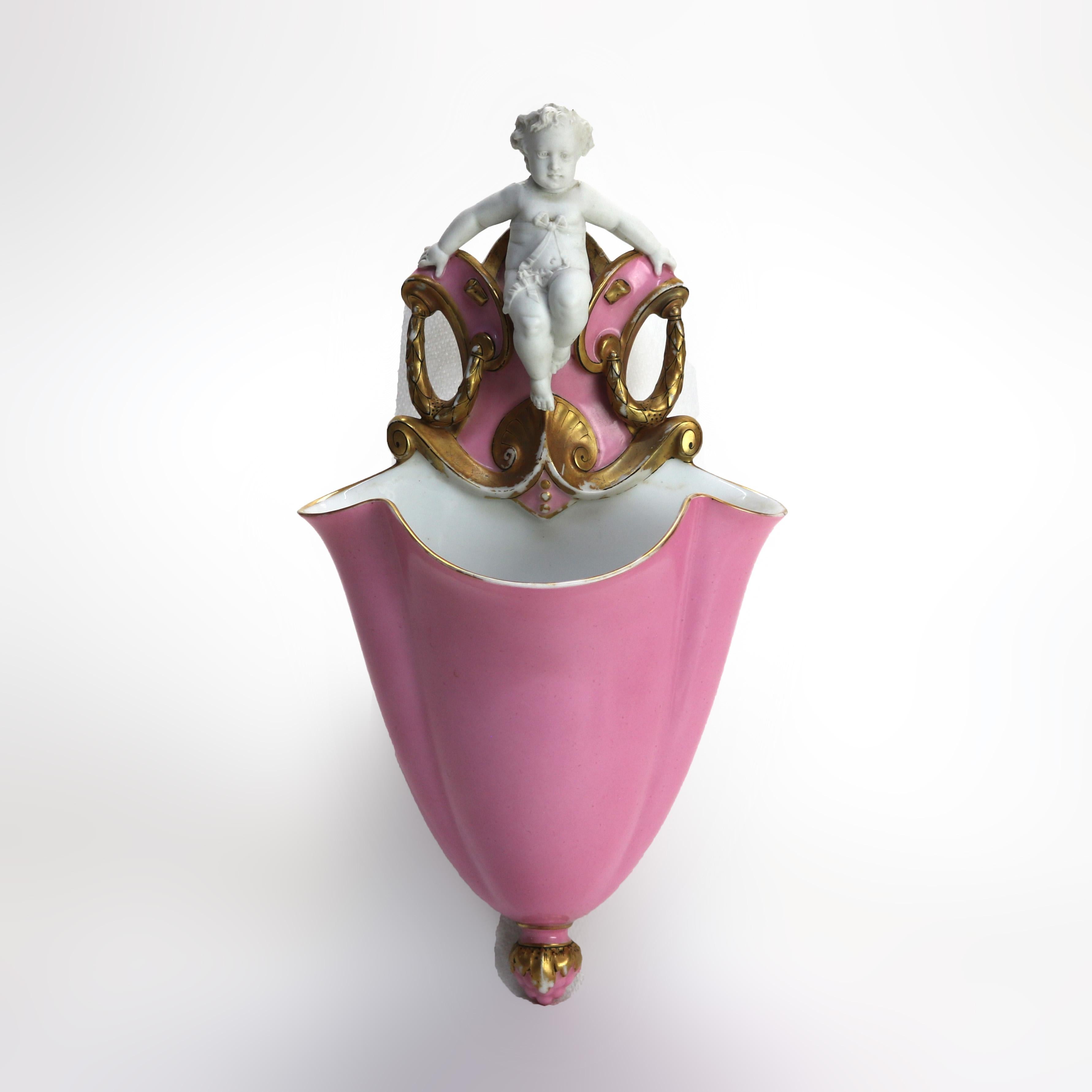 Ancienne pochette murale en porcelaine à figurine de chérubin signée C1880.
14