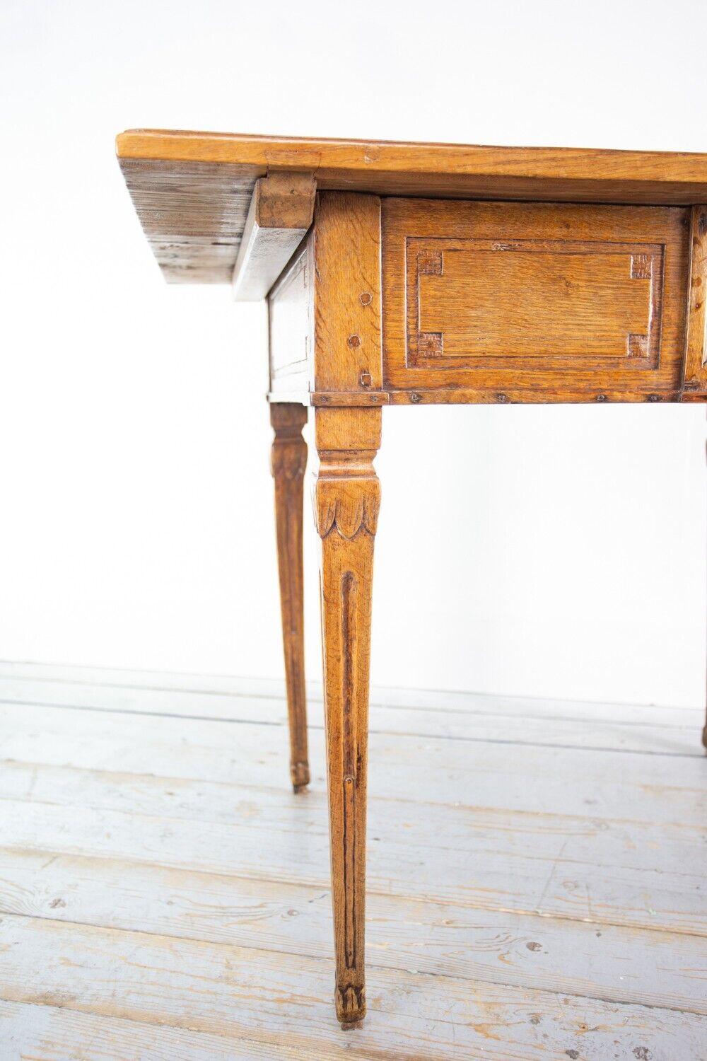 Antique Rustic Table

Oak side table with one long drawer, pegged in places, a two plank top and detailed carvings on the legs. Would make a nice crafting table, or for displaying items such as vases, photo frames, etcetera. 

Continental with