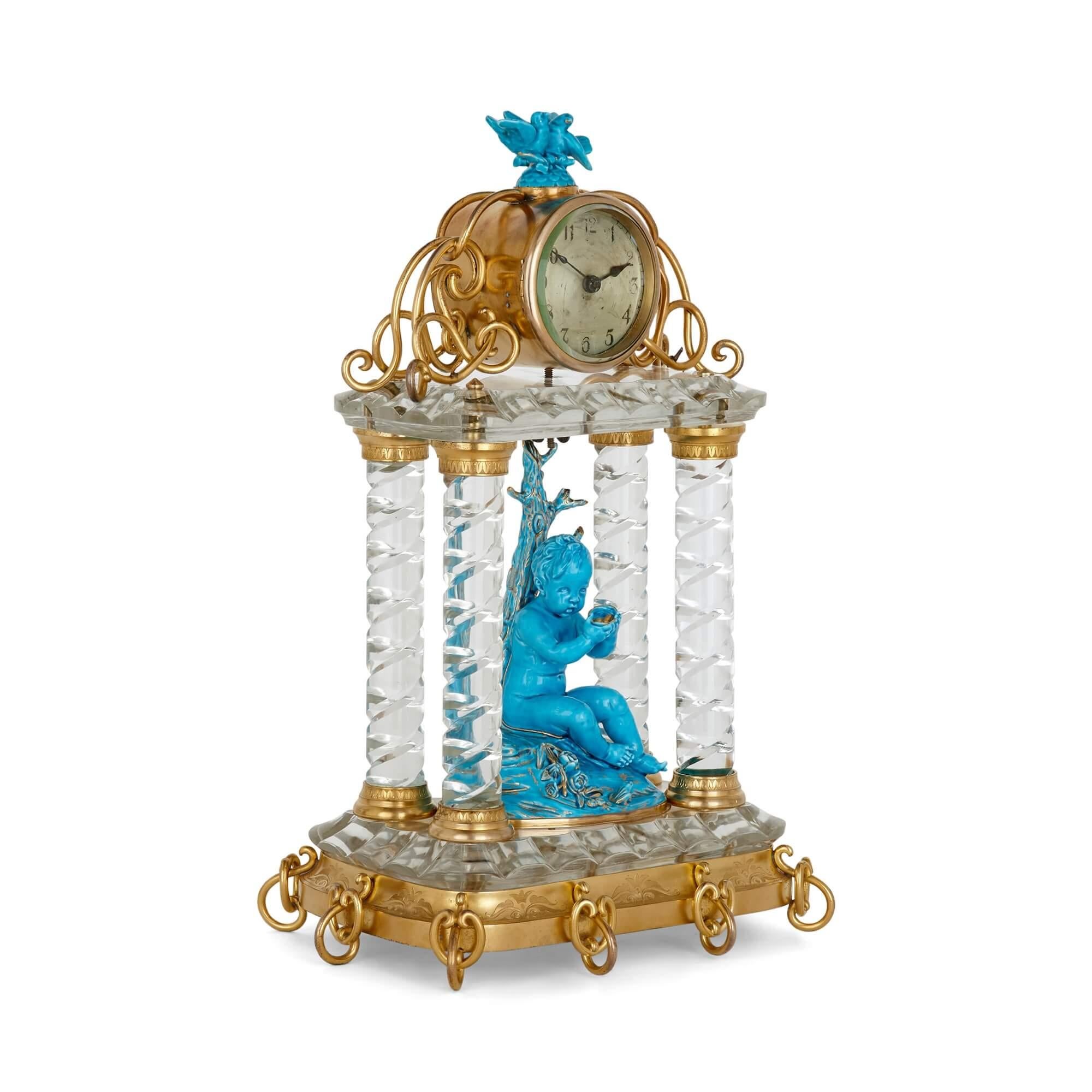 Antique Continental gilt bronze, cut glass, and porcelain clock set
Continental, late 19th century
Clock: Height 45cm, width 30cm, depth 22cm
Candelabra: Height 46cm, width 23cm, depth 23cm

This wonderful clock set includes a mantel clock and