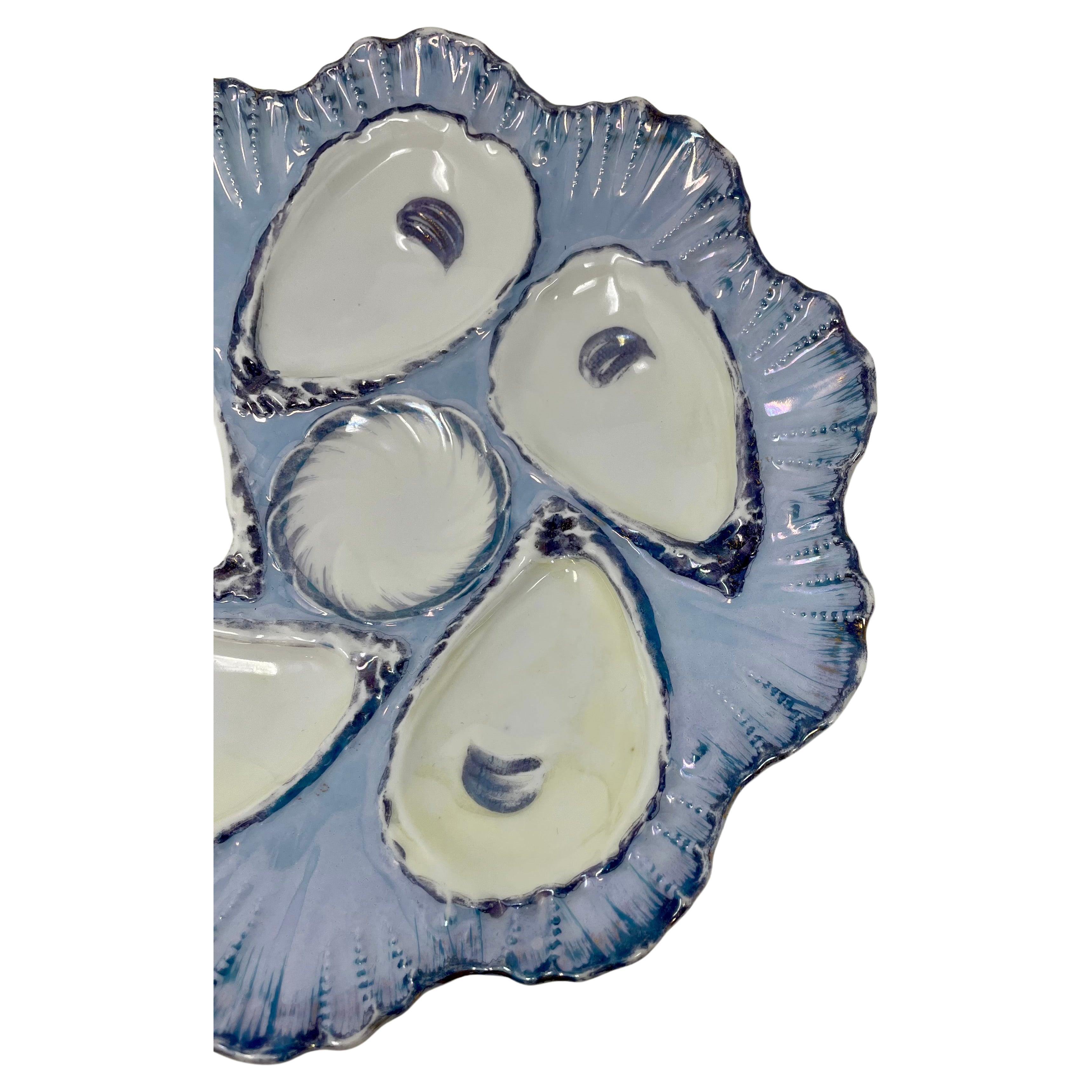 Antique continental hand-painted porcelain oyster plate, circa 1880-1890.
Beautiful and unusual colors of periwinkle and lavender blue