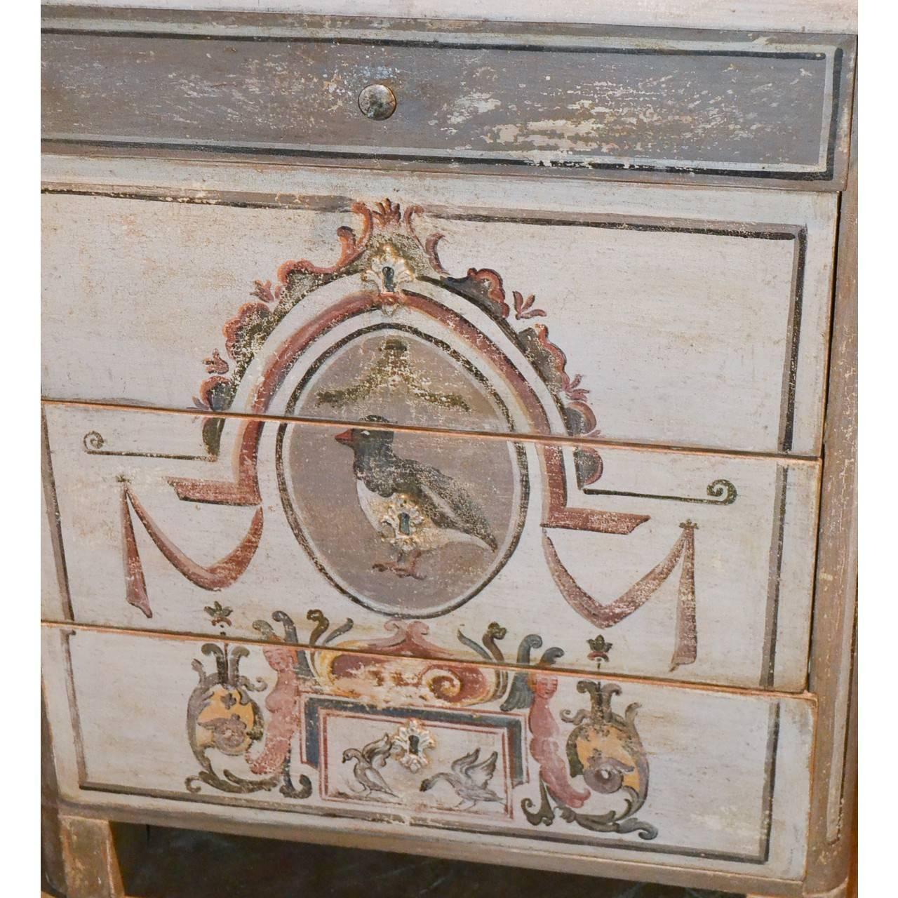 Sweetheart of a piece!

Lovely antique Continental four-drawer chest hand-painted in muted colors with stylized leaf scrolls, birds, and caryatid figures,

circa 1900.