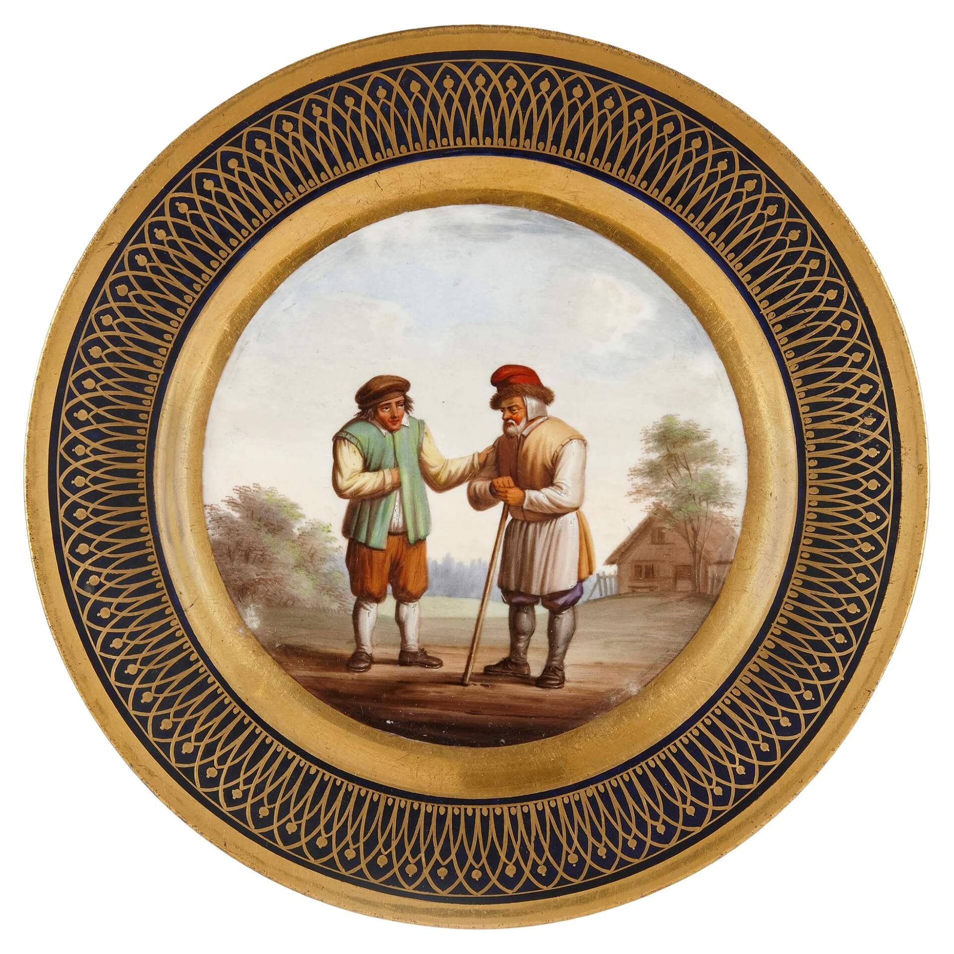 Antico piatto continentale in porcellana dorata con paesaggio pastorale