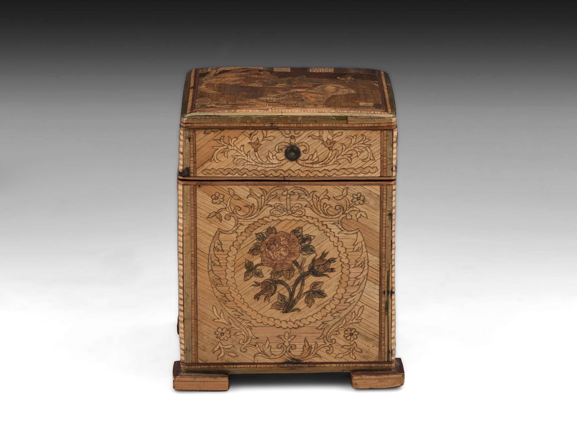 Straw work tea caddy. Skilfully made from pine covered with thin natural and dyed straw to create wonderful elaborate marquetry patterns. The sides each have a different flower marquetry and are framed with further elaborate designs. The lid