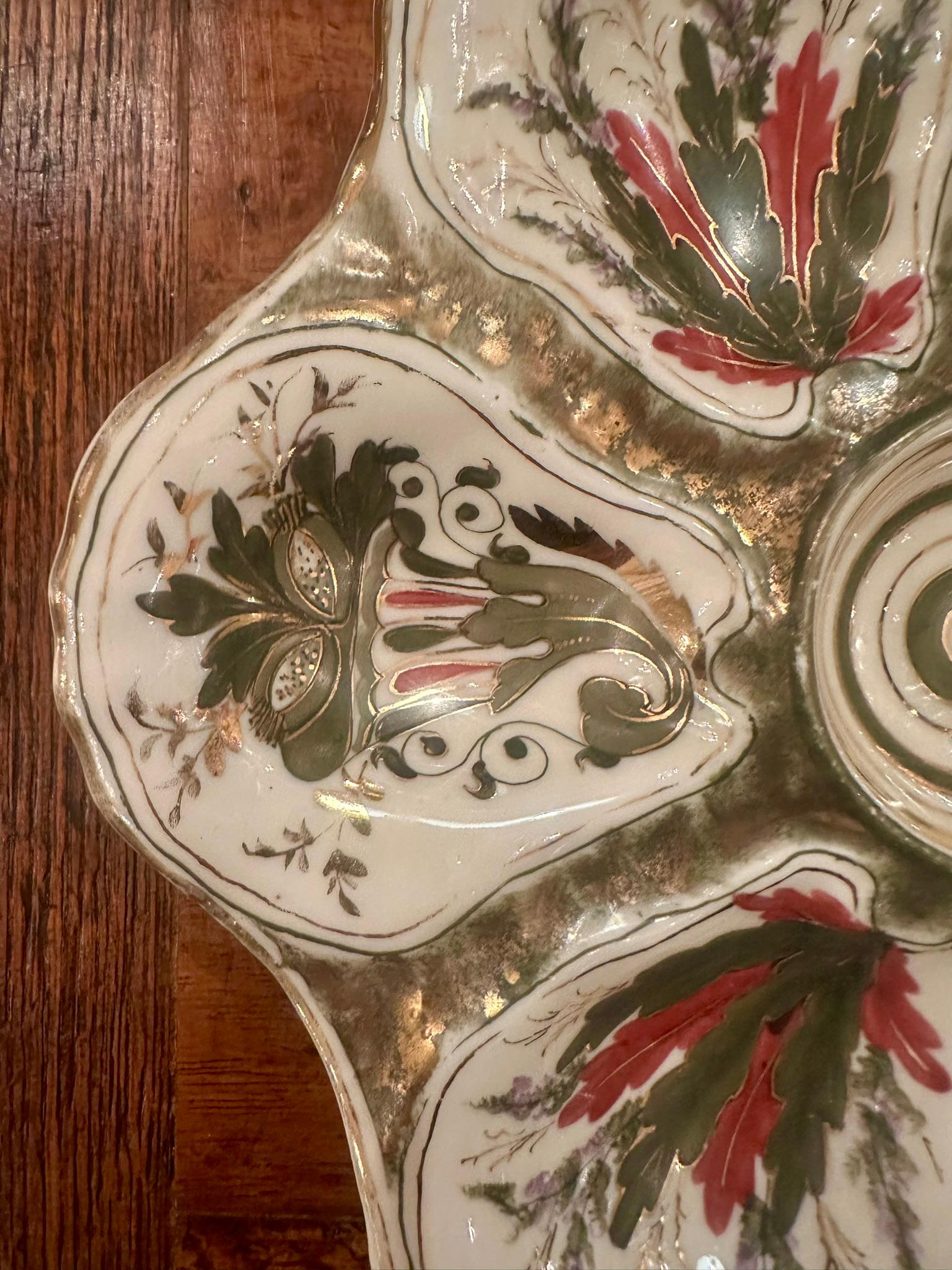 Antique Continental Porcelain Oyster Plate, Circa 1880-1890.
Hand-Painted Green, Red & Ivory with Soft Gold Details.