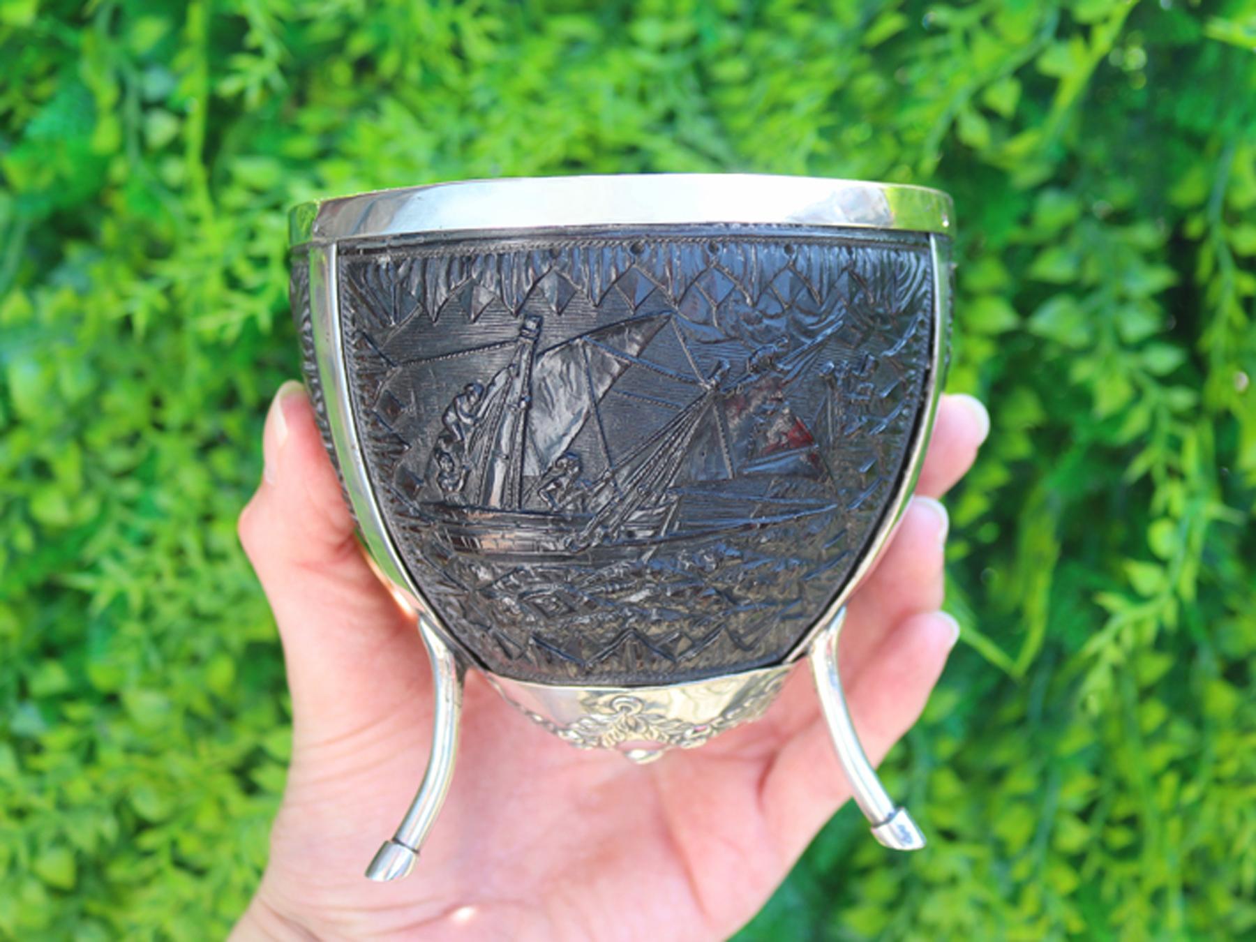 An exceptional, fine and impressive antique continental silver mounted coconut cup with nautical interest; an addition to our diverse ornamental silverware collection.

This exceptional antique silver mounted coconut cup has flared rim and plain