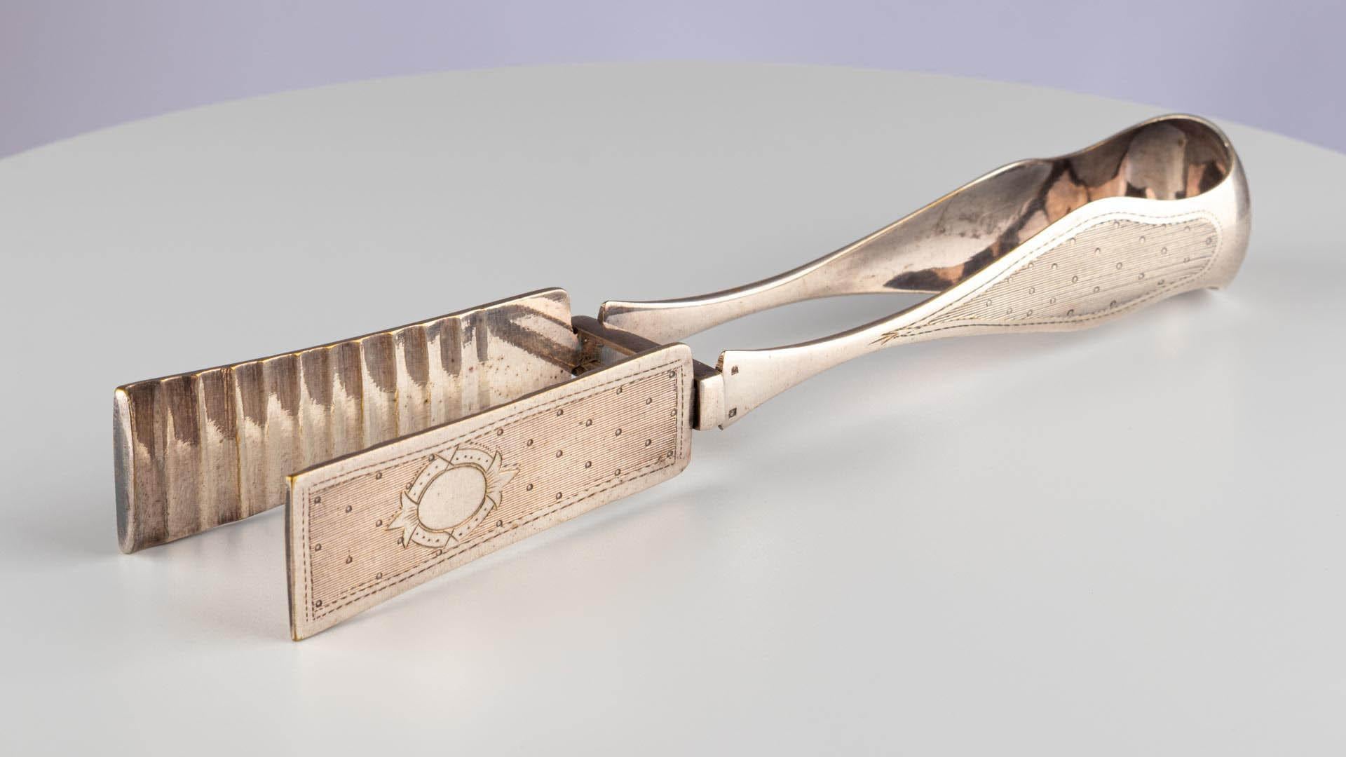 Antique Continental Silver Plate Asparagus Vegetable Tongs Cutlery

Continental
Silver plate
Late 19th Century

Dimensions: H x W x D: 3.5cm x 26cm x 5.5cm

Crafted from silver plate, these asparagus tongs date to the late 19th century. Asparagus